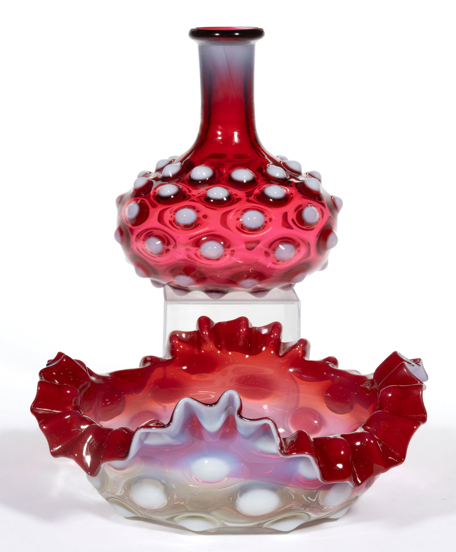 DEW DROP / HOBNAIL PATTERNED GLASS ARTICLES, LOT OF TWO: DEW DROP / HOBNAIL PATTERNED GLASS ARTICLES, LOT OF TWO, ruby opalescent, comprising one round bowl with large flat hobnails with a ruffled rim, and a carafe with hobnails around the body, thick neck,