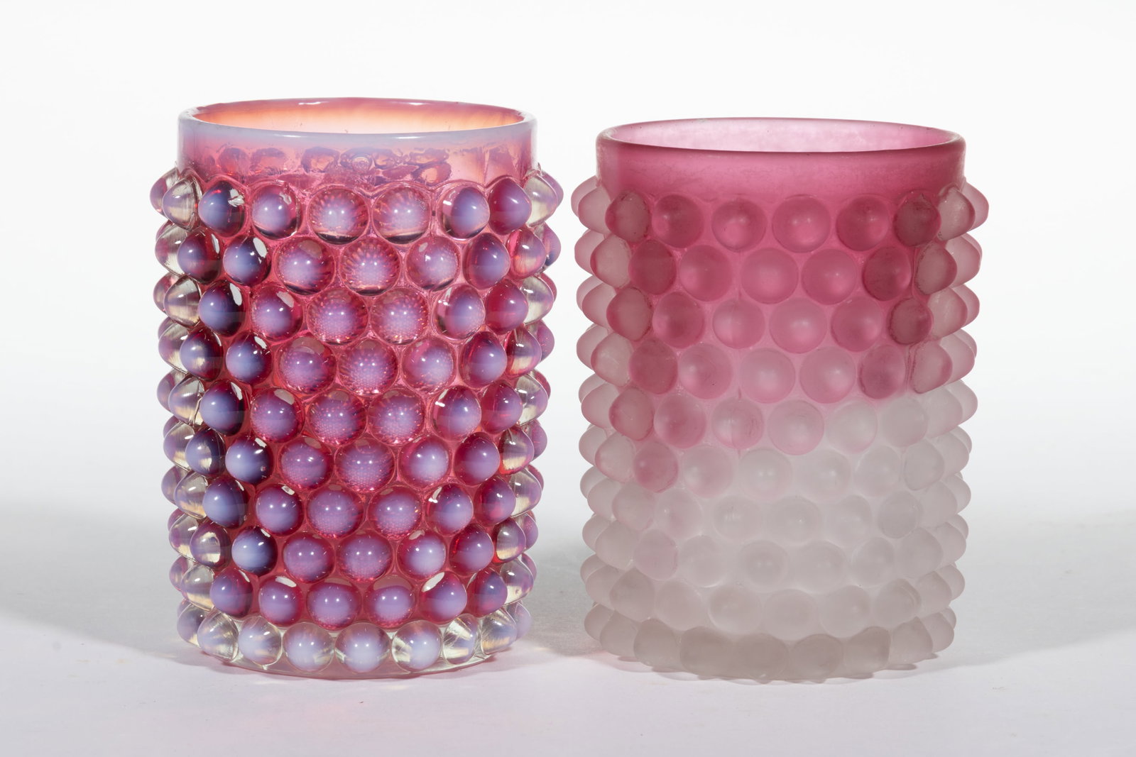 HOBBS NO. 323 DEW DROP / HOBNAIL TUMBLERS, LOT OF TWO: HOBBS NO. 323 DEW DROP / HOBNAIL TUMBLERS, LOT OF TWO, rubina frosted and cranberry opalescent, both having a polished pontil mark. Hobbs, Brockunier & Co. Pattern introduced in 1886. 3 7/8" 