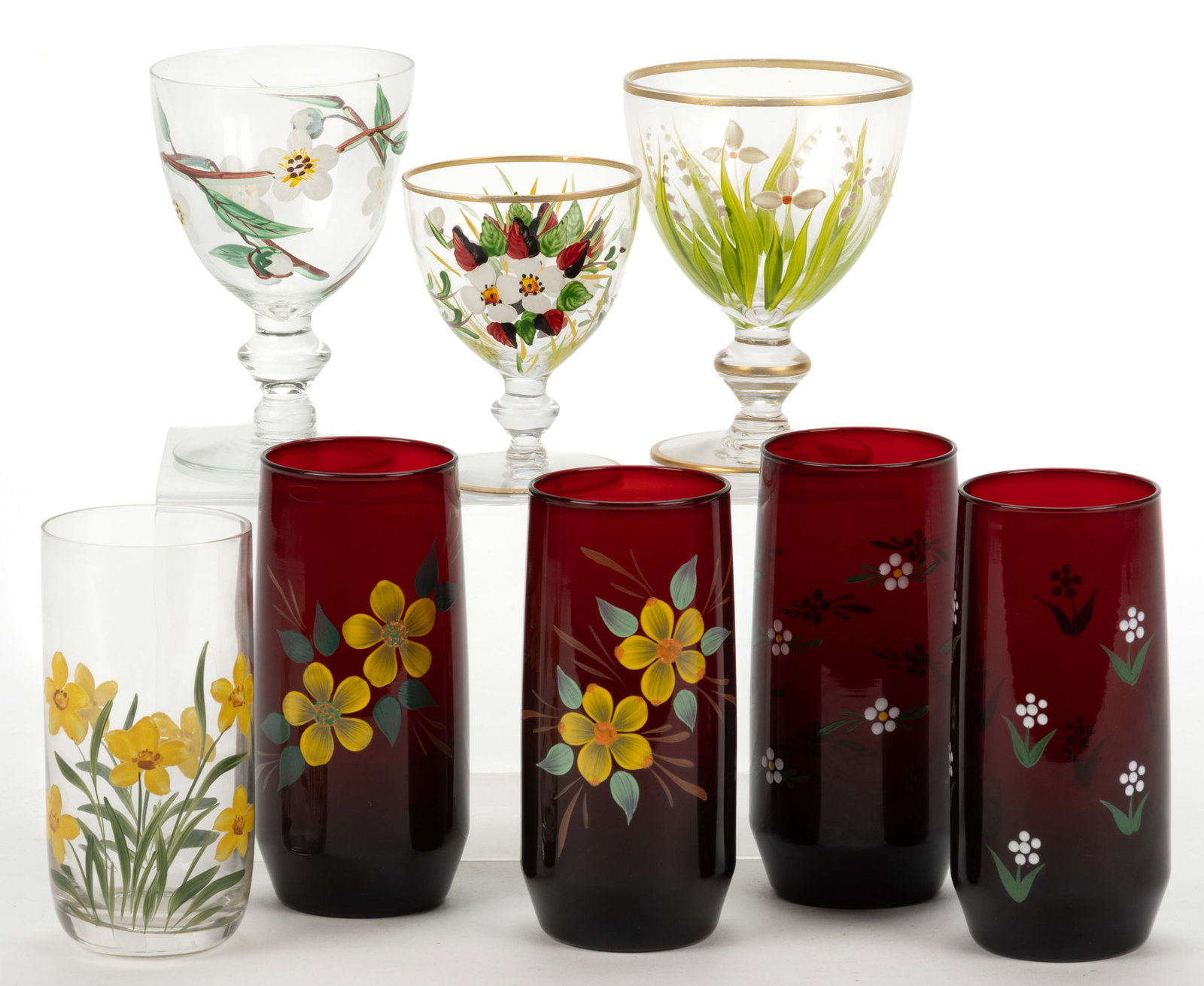 ASSORTED ENAMEL-DECORATED GLASS DRINKING ARTICLES, LOT OF EIGHT: ASSORTED ENAMEL-DECORATED GLASS DRINKING ARTICLES, LOT OF EIGHT, comprising four ruby red tumblers, one colorless tumbler, two medium and one small goblet with annular knop stems and round feet, all w