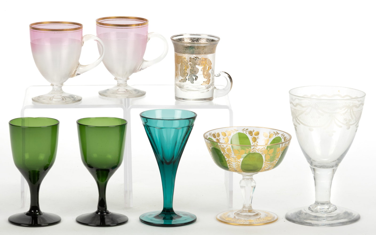 ASSORTED MOSER AND OTHER GLASS DRINKING ARTICLES, LOT OF EIGHT: ASSORTED MOSER AND OTHER GLASS DRINKING ARTICLES, LOT OF EIGHT, various colors, comprising an enamel and gilt-decorated champagne glass, emerald green paneled wine glass, two forest green wine glasses