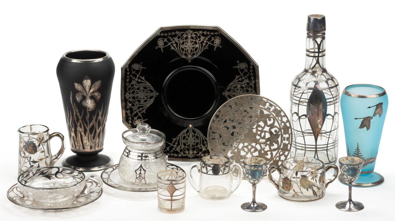 ASSORTED SILVER-OVERLAY ART GLASS ARTICLES, LOT OF 15: ASSORTED SILVER-OVERLAY ART GLASS ARTICLES, LOT OF 15, various colors, including one sky blue and one black Dahlia vase, sky blue vase marked "Rockwell" on base, Webster trivet, nappy a