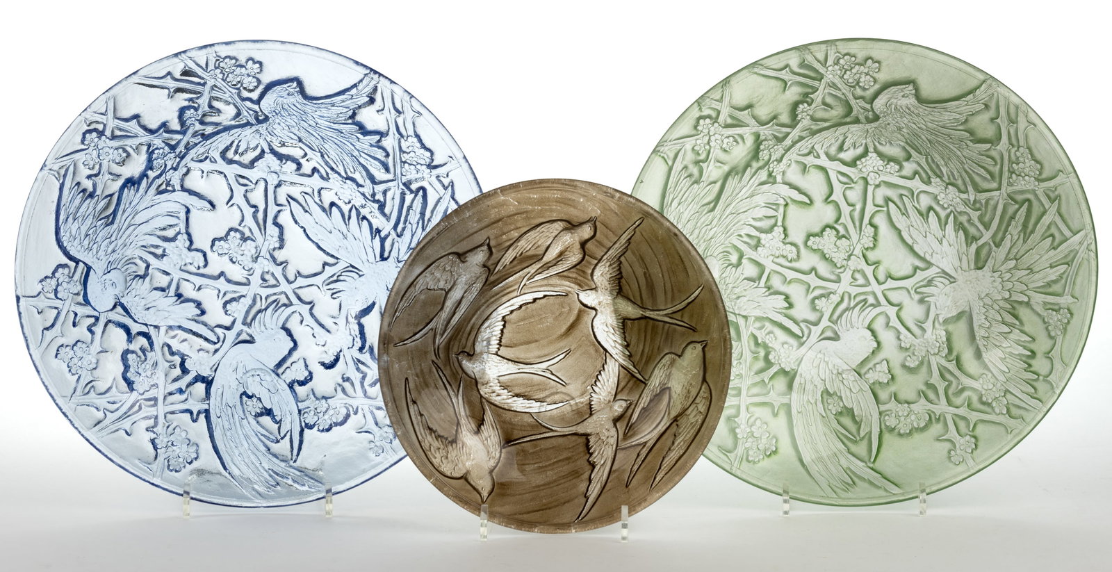 CONSOLIDATED ART GLASS BIRD MOTIF BOWLS, LOT OF THREE: CONSOLIDATED ART GLASS BIRD MOTIF BOWLS, LOT OF THREE, blue, colorless with green wash, and colorless with sepia wash, comprising two Cockatoo console bowls and a Swallows bowl. Consolidated Lamp &
