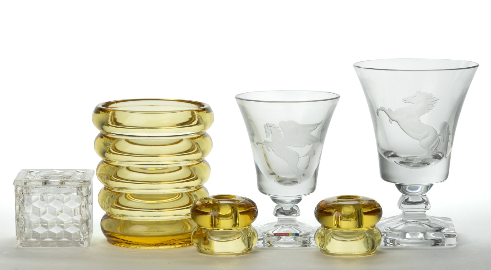 FOSTORIA GLASS ARTICLES, LOT OF SIX: FOSTORIA GLASS ARTICLES, LOT OF SIX, colorless and topaz, comprising an American Square puff box, a Sakier Spool vase, a pair of candlesticks, and two vases each on square-footed pedestal ba