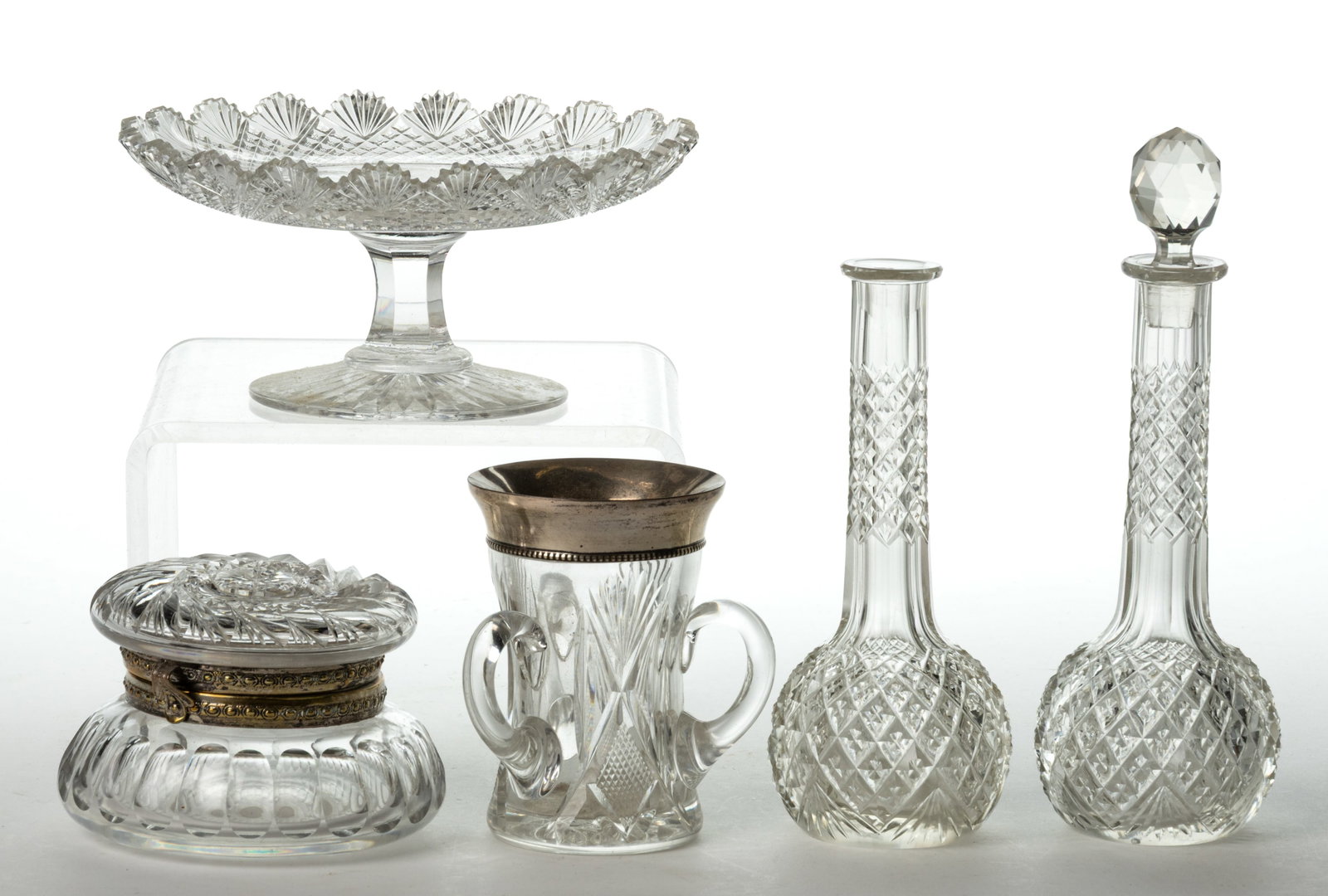 AMERICAN BRILLIANT CUT GLASS ARTICLES, LOT OF FIVE: AMERICAN BRILLIANT CUT GLASS ARTICLES, LOT OF FIVE, colorless, comprising a small lover cup with three handles and sterling silver rim, marked "STERLING", a C.F. Monroe No. 1 jewel puff box,