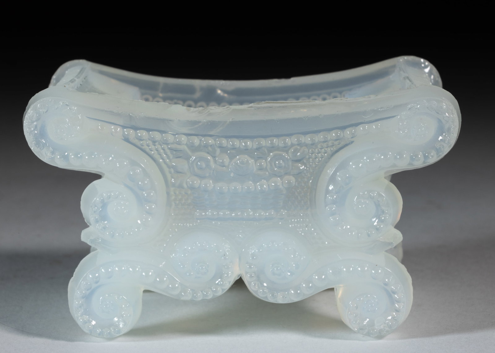 BS-3 BEADED SCROLL AND BASKET OF FLOWERS PRESSED OPEN SALT: BS-3 BEADED SCROLL AND BASKET OF FLOWERS PRESSED OPEN SALT, unlisted swirling opalescent alabaster/clambroth, on four scrolled feet, rayed star base. Probably very rare. Boston & Sandwich Gla