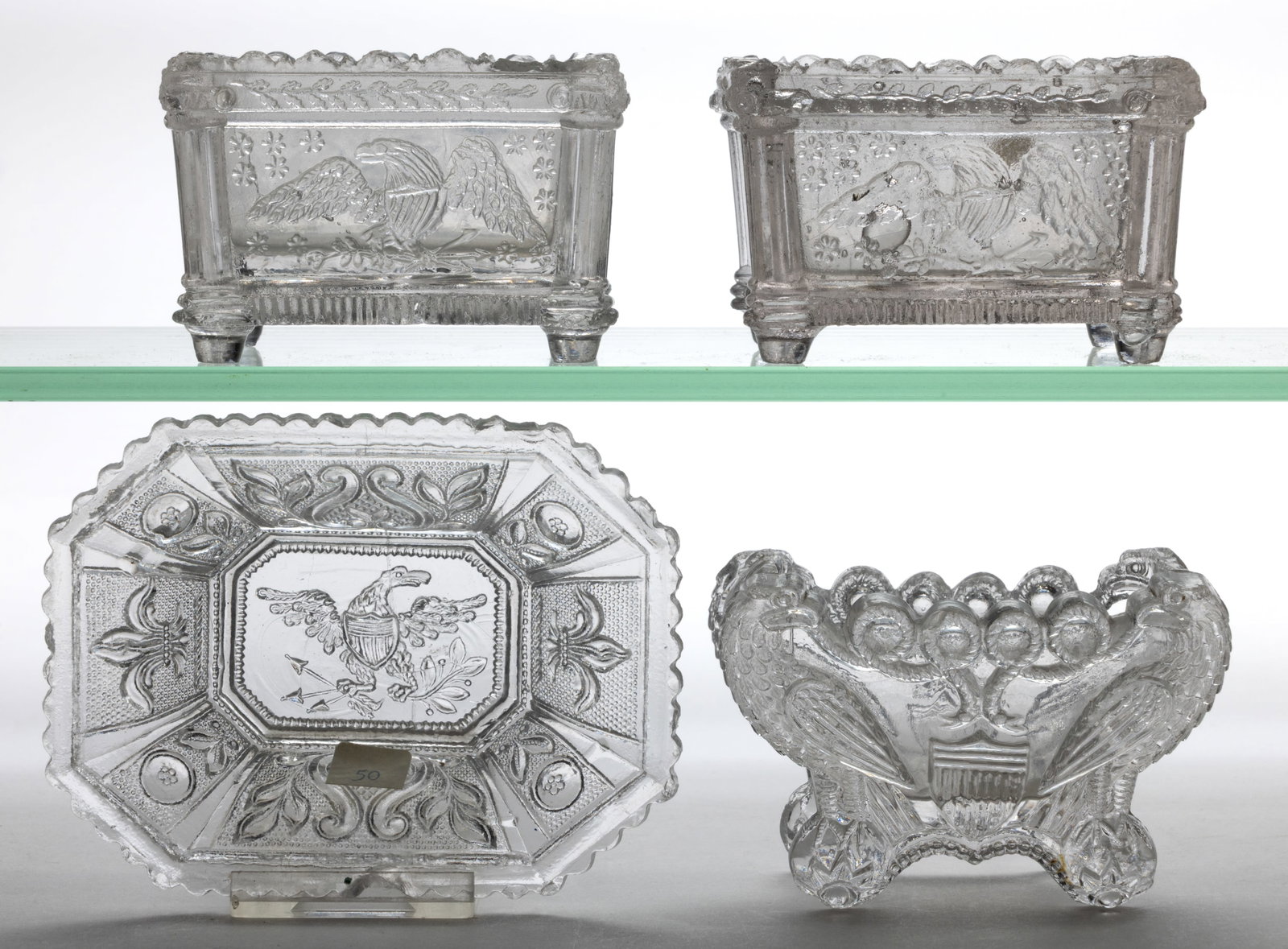 ASSORTED EE EAGLE PRESSED OPEN SALTS, LOT OF FOUR: ASSORTED EE EAGLE PRESSED OPEN SALTS, LOT OF FOUR, colorless, comprising two EE-1a, EE-3b, and EE-5. Plentiful, scarce, and rare. Boston & Sandwich Glass Co. and possibly others. 1830-1845.