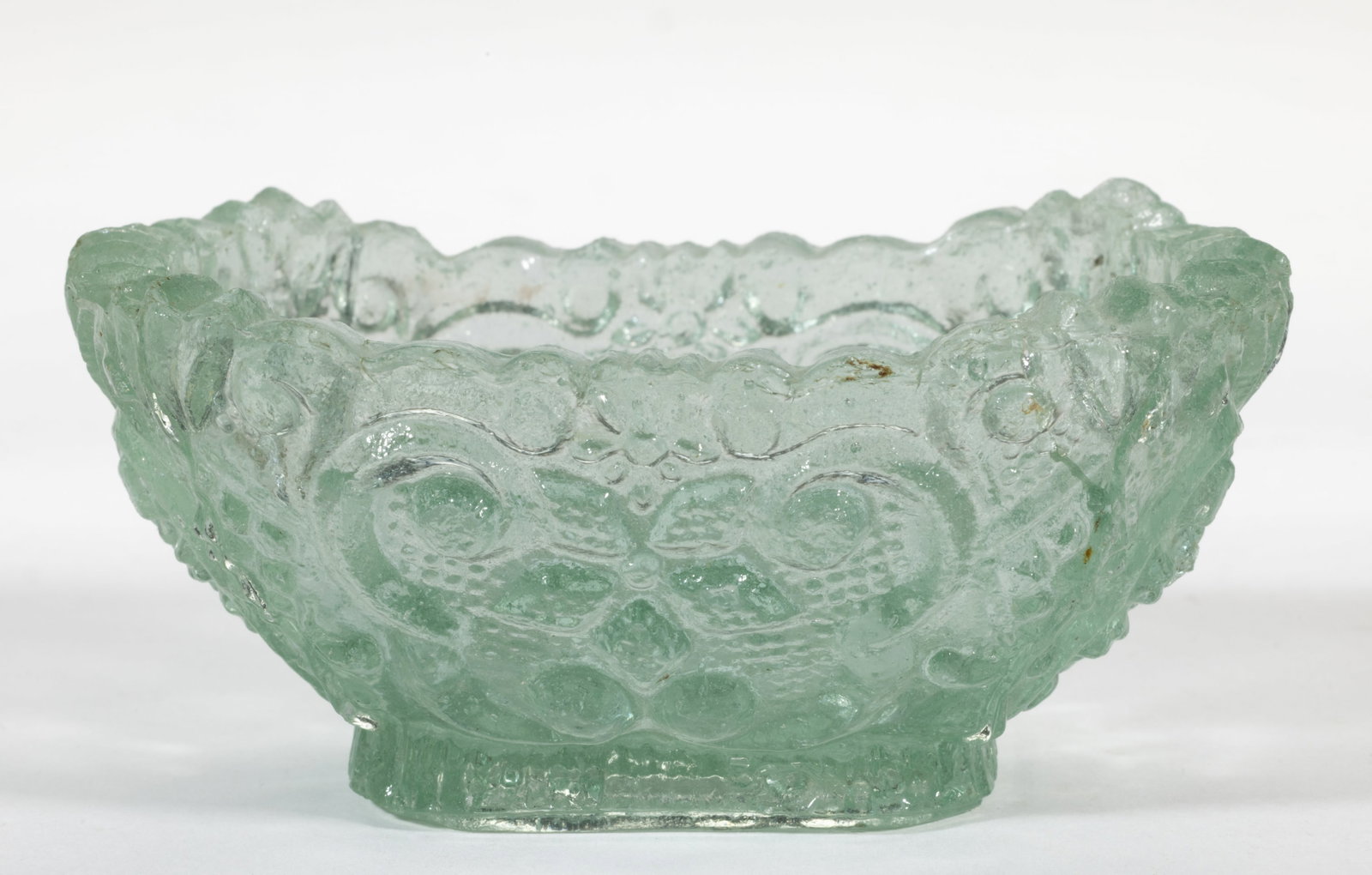 OL-20 VARIANT DIAMOND STAR AND SCROLL OVAL PRESSED OPEN SALT: OL-20 VARIANT DIAMOND STAR AND SCROLL OVAL PRESSED OPEN SALT, bottle green, complex shaped rim, serrated base edge. Variation with diamonds in side stars not touching, and base with random dots.