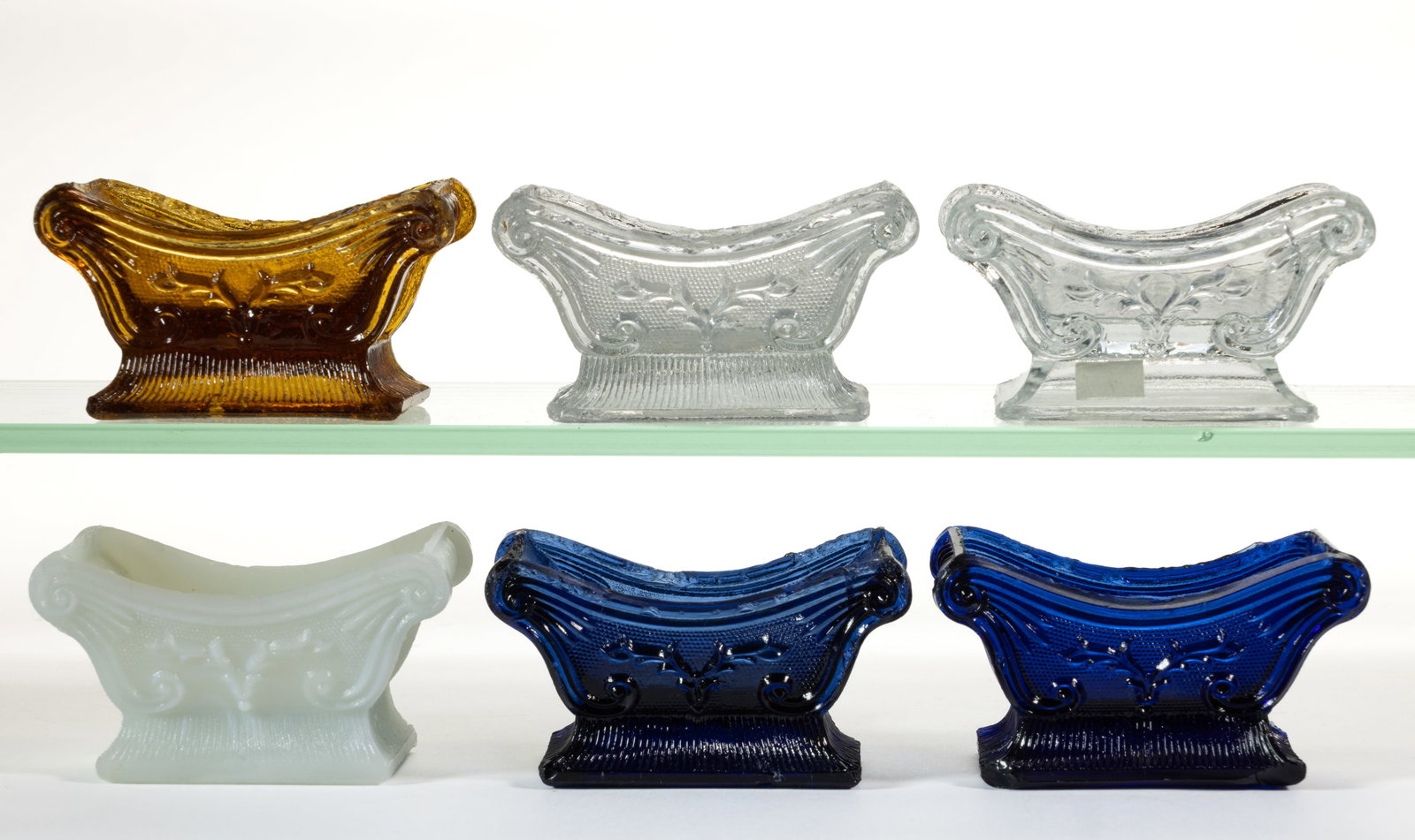 ASSORTED SN STAG HORN PRESSED OPEN SALTS, LOT OF SIX: ASSORTED SN STAG HORN PRESSED OPEN SALTS, LOT OF SIX, comprising colorless, cobalt blue, and sapphire blue SN-1, unlisted amber SN-1a, clambroth SN-1b, and colorless SN-2a. Plentiful, scarce, rare, ve