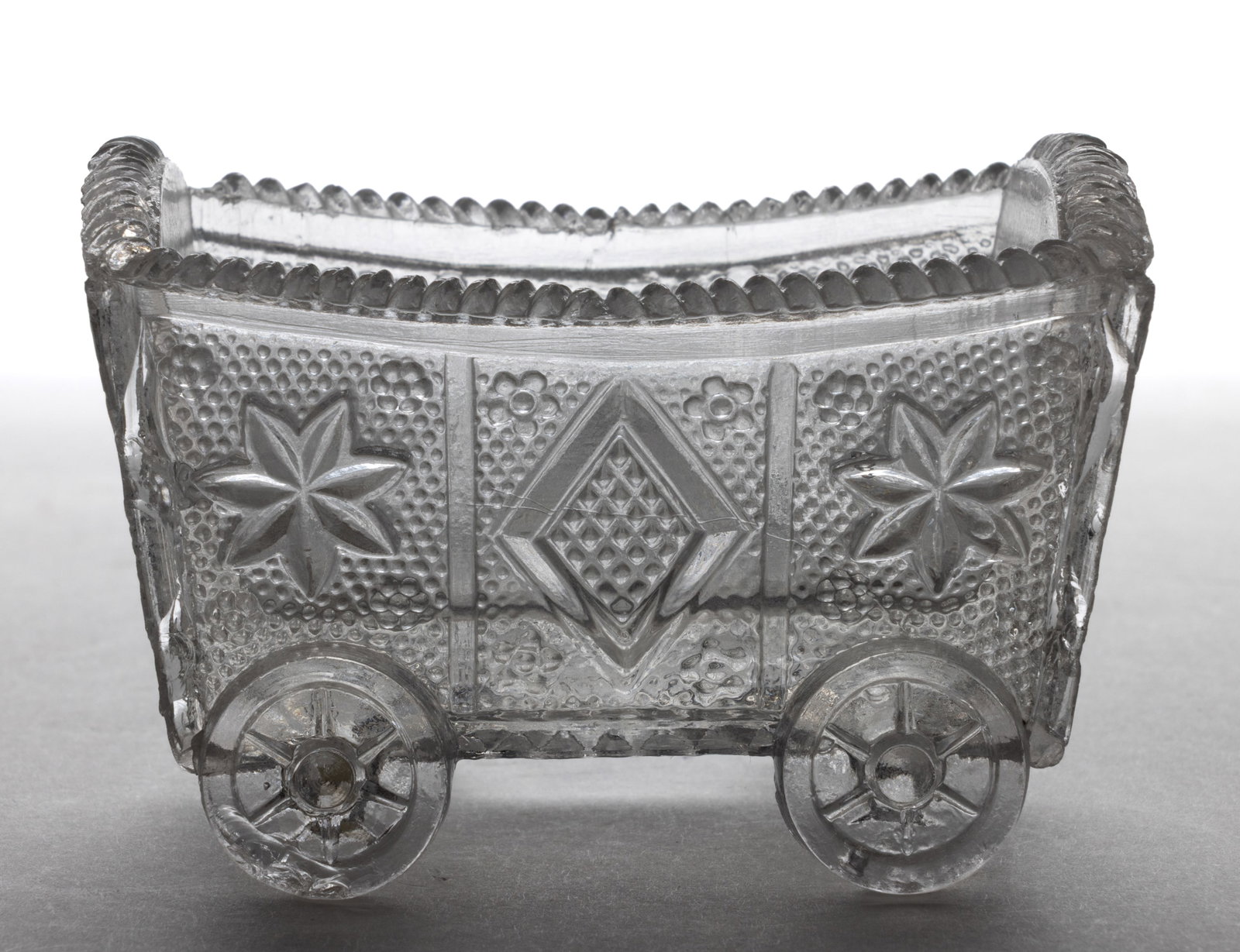 WN-1A WAGON PRESSED OPEN SALT: WN-1A WAGON PRESSED OPEN SALT, colorless, rope rim, raised on four wheels. Extremely rare. Possibly Boston & Sandwich Glass Co. 1830-1845. 2" H, 2" x 3". Literature: Neal -&nbs