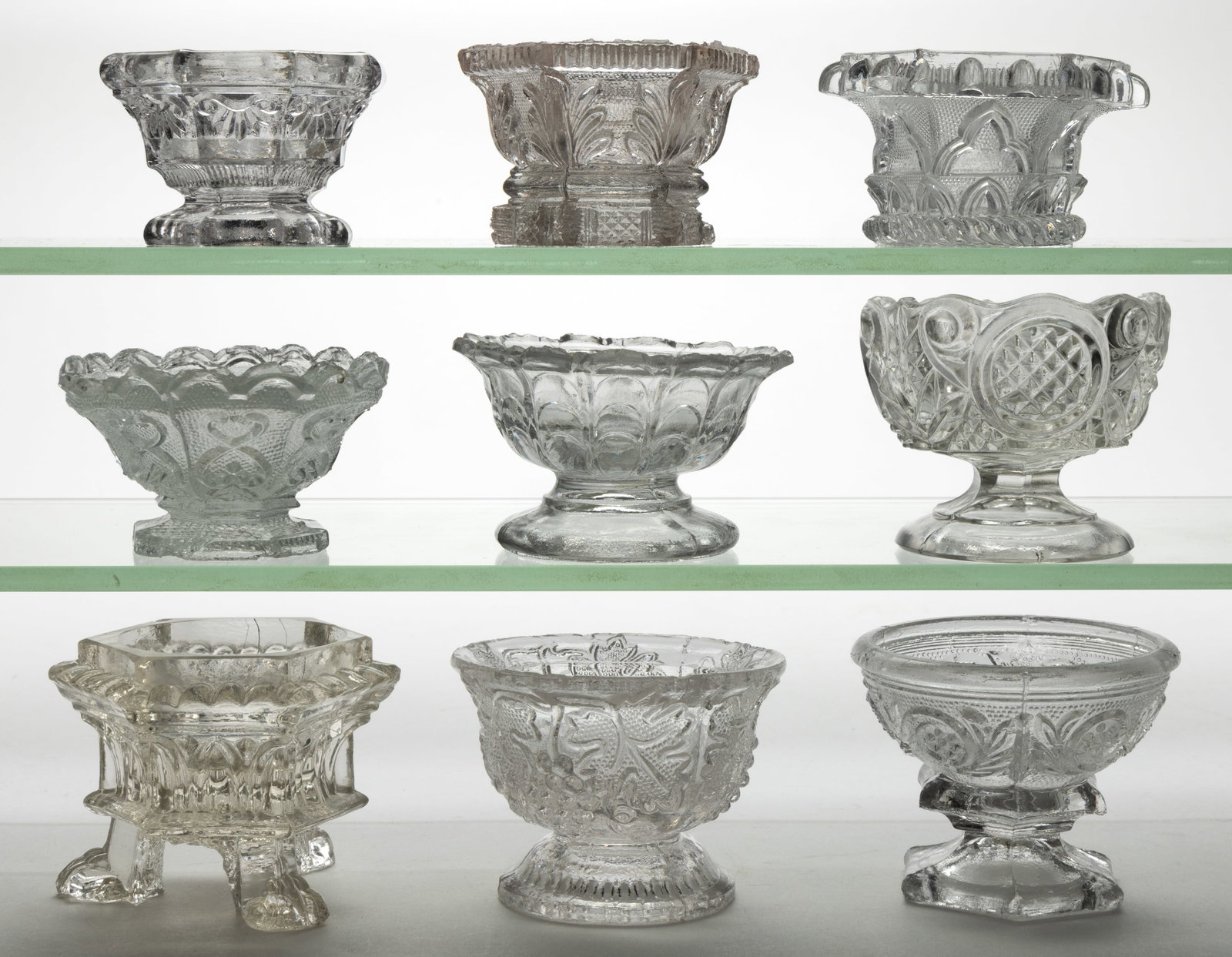 ASSORTED LACY-PERIOD AND OTHER PRESSED OPEN SALTS, LOT OF NINE (1 of 1)