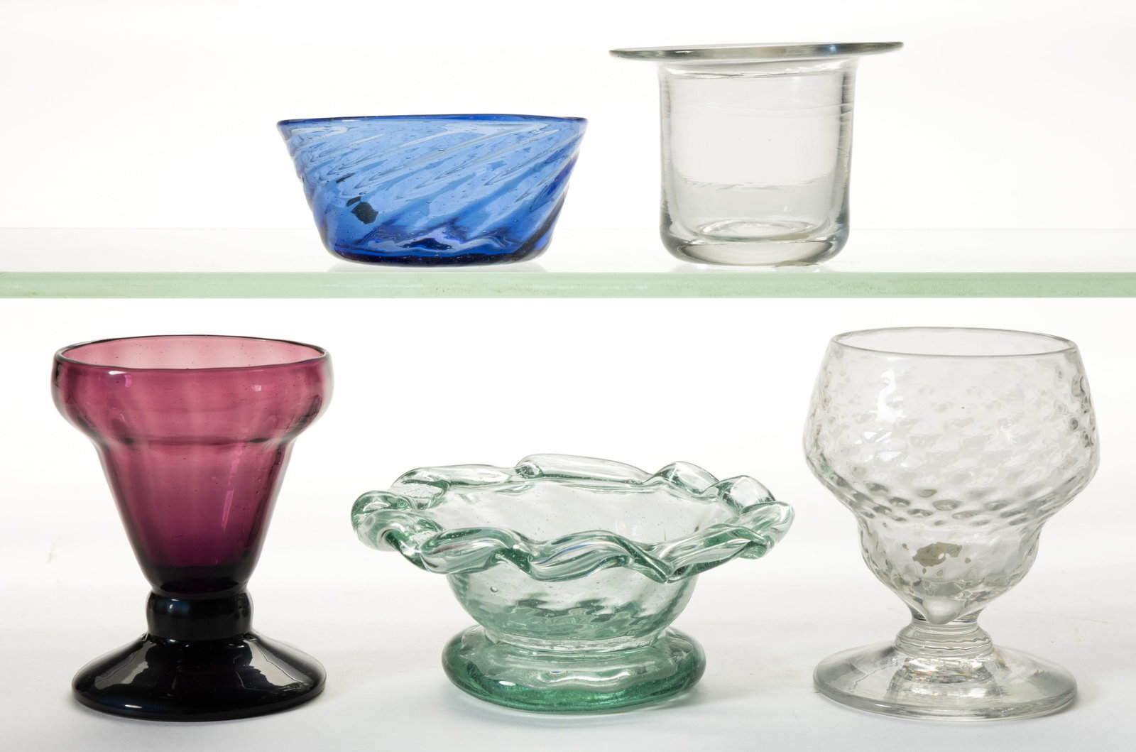 ASSORTED BLOWN OPEN SALTS, LOT OF FIVE: ASSORTED BLOWN OPEN SALTS, LOT OF FIVE, amethyst, colorless, sapphire blue, and bottle green, four are pattern molded with diamond, swirls, or ribs, each with a rough pontil mark. Pairpoint, Mexico,