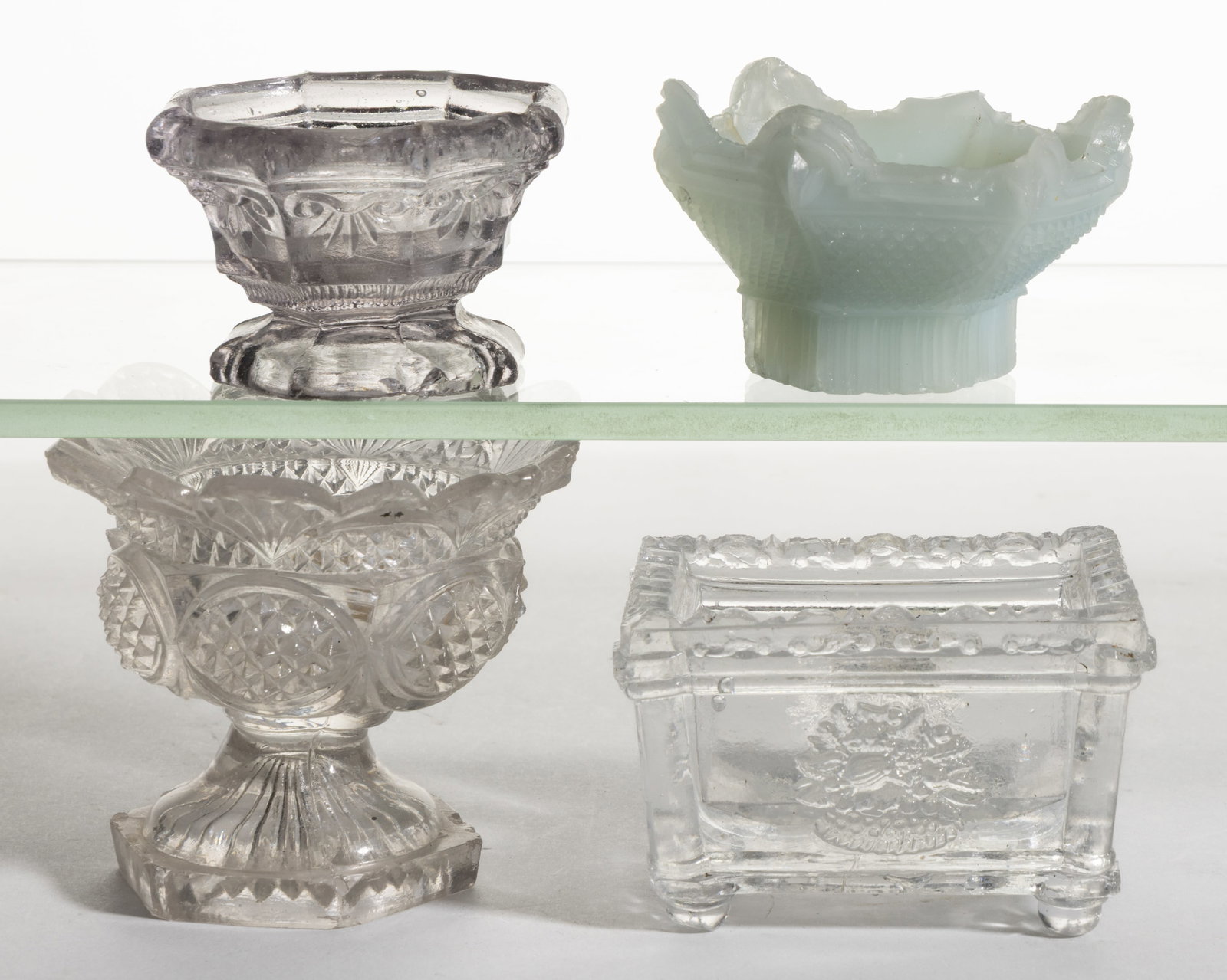 ASSORTED PRESSED GLASS OPEN SALTS, LOT OF FOUR: ASSORTED PRESSED GLASS OPEN SALTS, LOT OF FOUR, comprising an OR-9, RP-32, NE-4 Variant without embossed periods to the underside after N and E, and an unrecorded HN, similar to HN-17 w