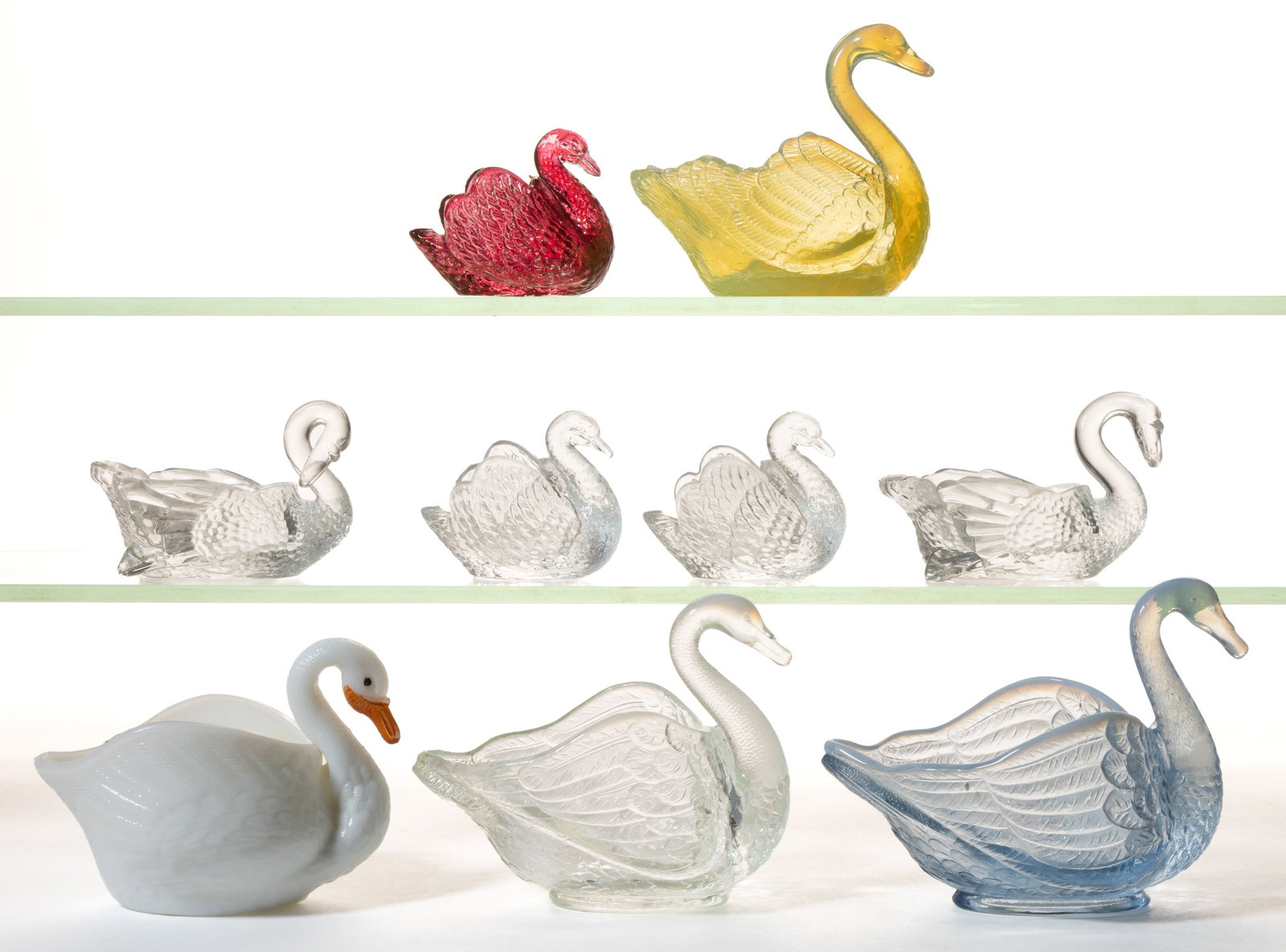 ASSORTED PRESSED FIGURAL SWAN GLASS OPEN SALTS, LOT OF NINE (1 of 1)
