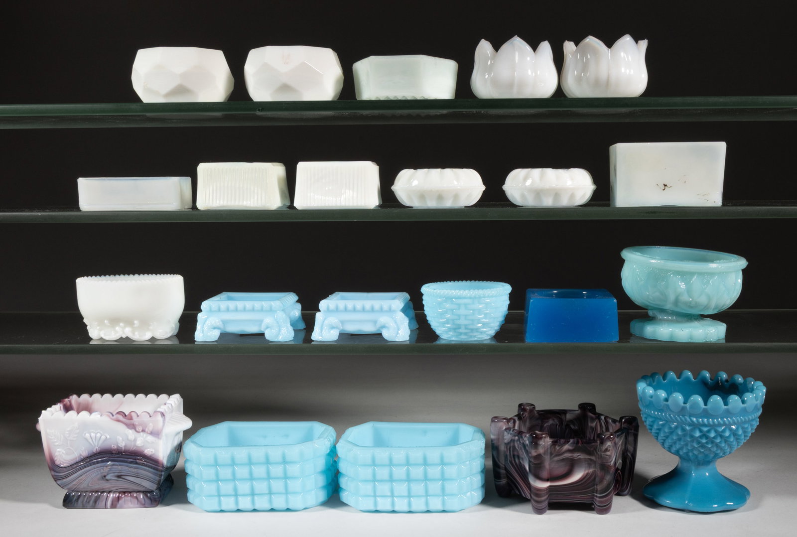 ASSORTED PRESSED OPAQUE GLASS OPEN SALTS, LOT OF 22: ASSORTED PRESSED OPAQUE GLASS OPEN SALTS, LOT OF 22, including opaque white, powder blue, purple slag/mosaic, and starch blue, including a mosaic example marked for Sowerby, a small basket-weave patte