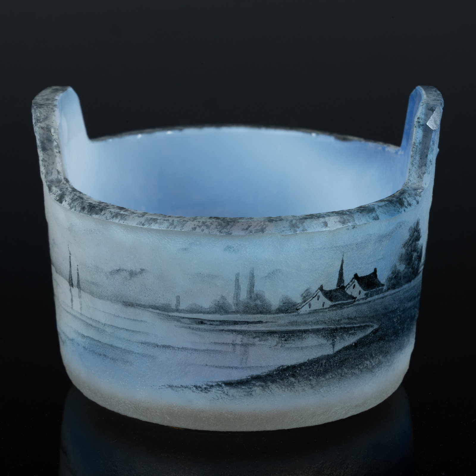 DAUM ENAMEL-DECORATED CAMEO ART GLASS OPEN SALT: DAUM ENAMEL-DECORATED CAMEO ART GLASS OPEN SALT, opalescent with black-enamel decoration, circular form with two tab handles, depicting a sailing scene, signed to the underside "Daum / 