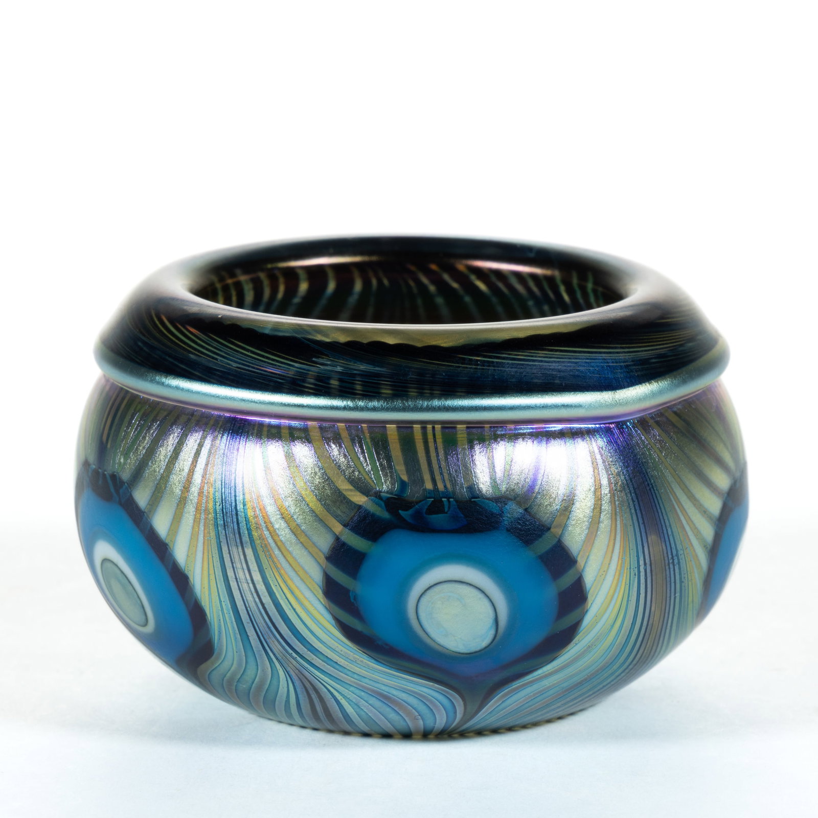 JEREMIAH LOTTON (AMERICAN, B. 1982) IRIDESCENT SURFACE DECORATED STUDIO ART GLASS OPEN SALT: JEREMIAH LOTTON (AMERICAN, B. 1982) IRIDESCENT SURFACE DECORATED STUDIO ART GLASS OPEN SALT, iridescent surface, with peacock feather decoration, signed to underside "Jeremiah Lotton / No54 