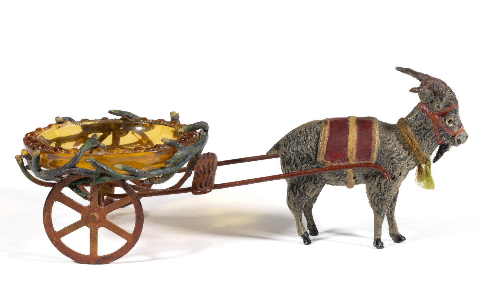 INTAGLIO GLASS OPEN SALT IN FIGURAL GOAT CART STAND: INTAGLIO GLASS OPEN SALT IN FIGURAL GOAT CART STAND, comprising an amber salt with decorated rim featuring a ship fitted into a cold-painted cast-metal cart pulled by a goat. Czechoslov