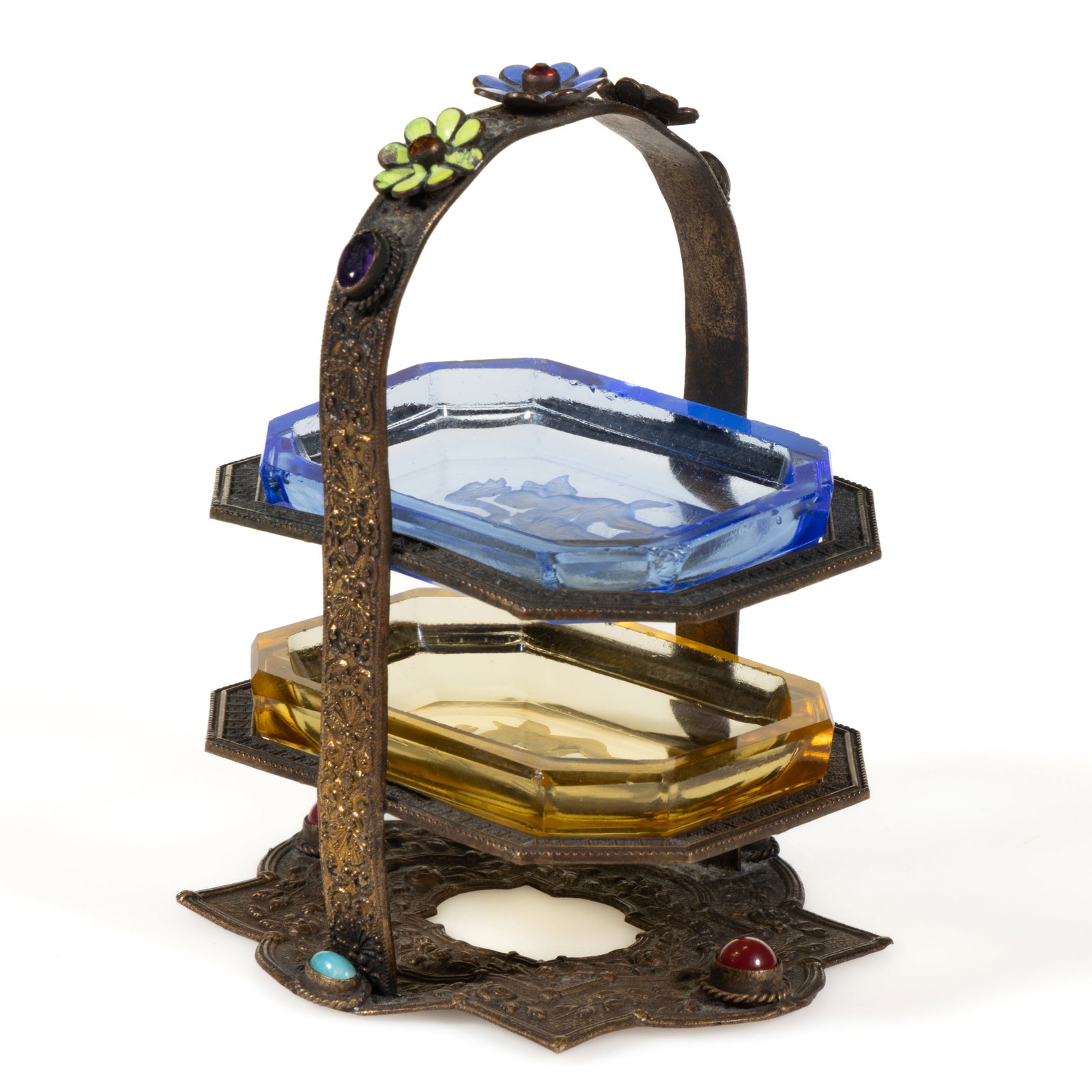 INTAGLIO GLASS OPEN SALTS IN STAND: INTAGLIO GLASS OPEN SALTS IN STAND, blue and yellow, comprising two salts featuring a matching putti scene, each having a factory-polished rim and edge, fitted into a gilt metal stand with a