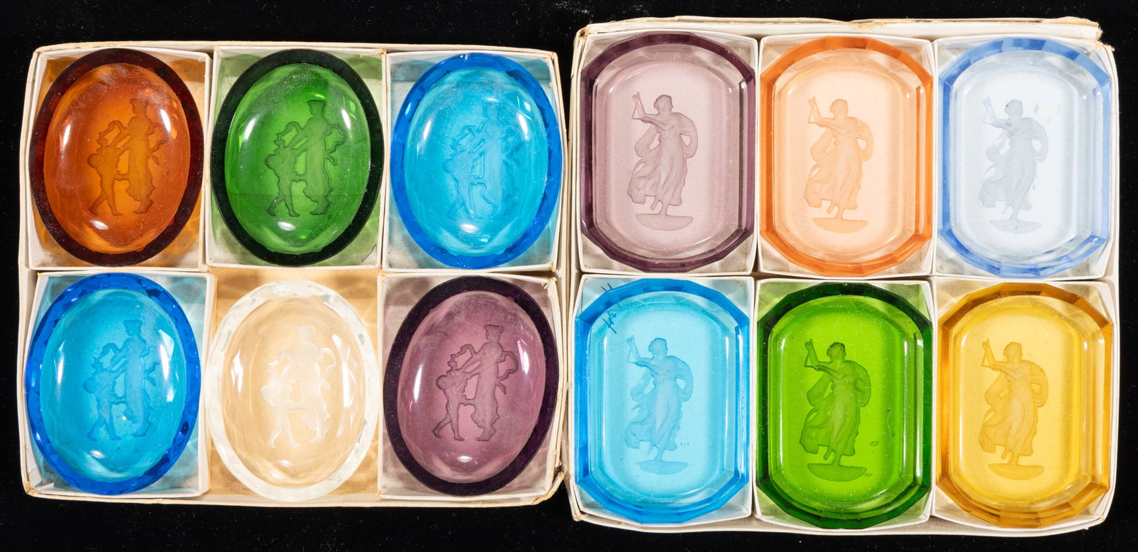 INTAGLIO GLASS OPEN SALTS, LOT OF 12: INTAGLIO GLASS OPEN SALT, LOT OF 12, various colors, comprising two sets of salts in period boxes, each salt featuring a Classical scene, each having a factory-polished rim and edge. Czechoslovak