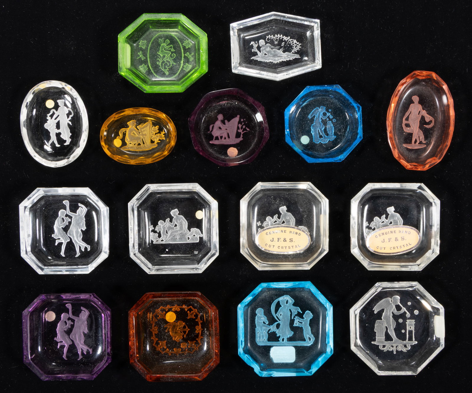INTAGLIO GLASS OPEN SALTS, LOT OF 15: INTAGLIO GLASS OPEN SALTS, LOT OF 15, various colors, each featuring Classical figures, each having a factory-polished rim and edge, two retain "Genuine Hand / J. F. & S. / Cut Crystal" 