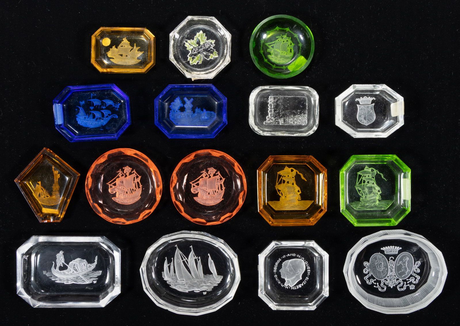 INTAGLIO GLASS OPEN SALTS, LOT OF 16: INTAGLIO GLASS OPEN SALTS, LOT OF 16, various colors, including one featuring the statue of liberty, one a gondola and gondolier, one a Niagara and Horseshoe Falls scene, and seven