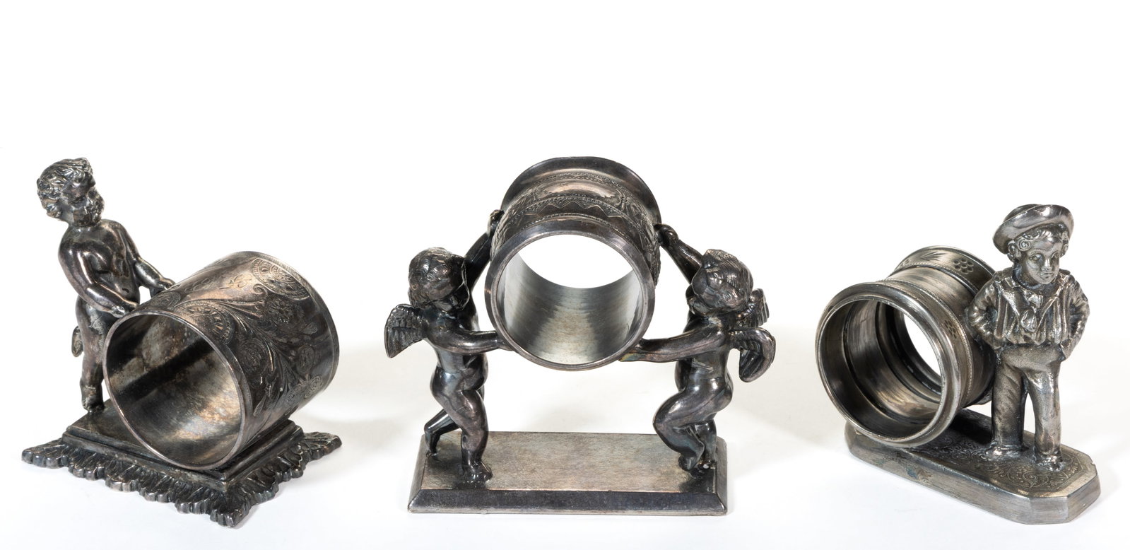 SIMPSON, HALL, MILLER & CO. AND OTHER CHERUB / CHILD FIGURAL SILVER-PLATED NAPKIN RINGS, LOT OF (1 of 2)