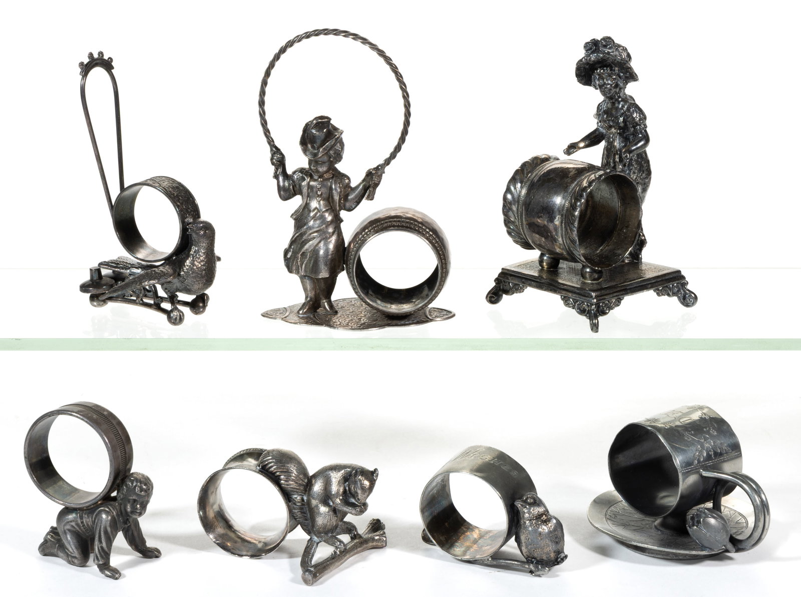 ASSORTED FIGURAL SILVER-PLATED NAPKIN RINGS, LOT OF SEVEN (1 of 1)