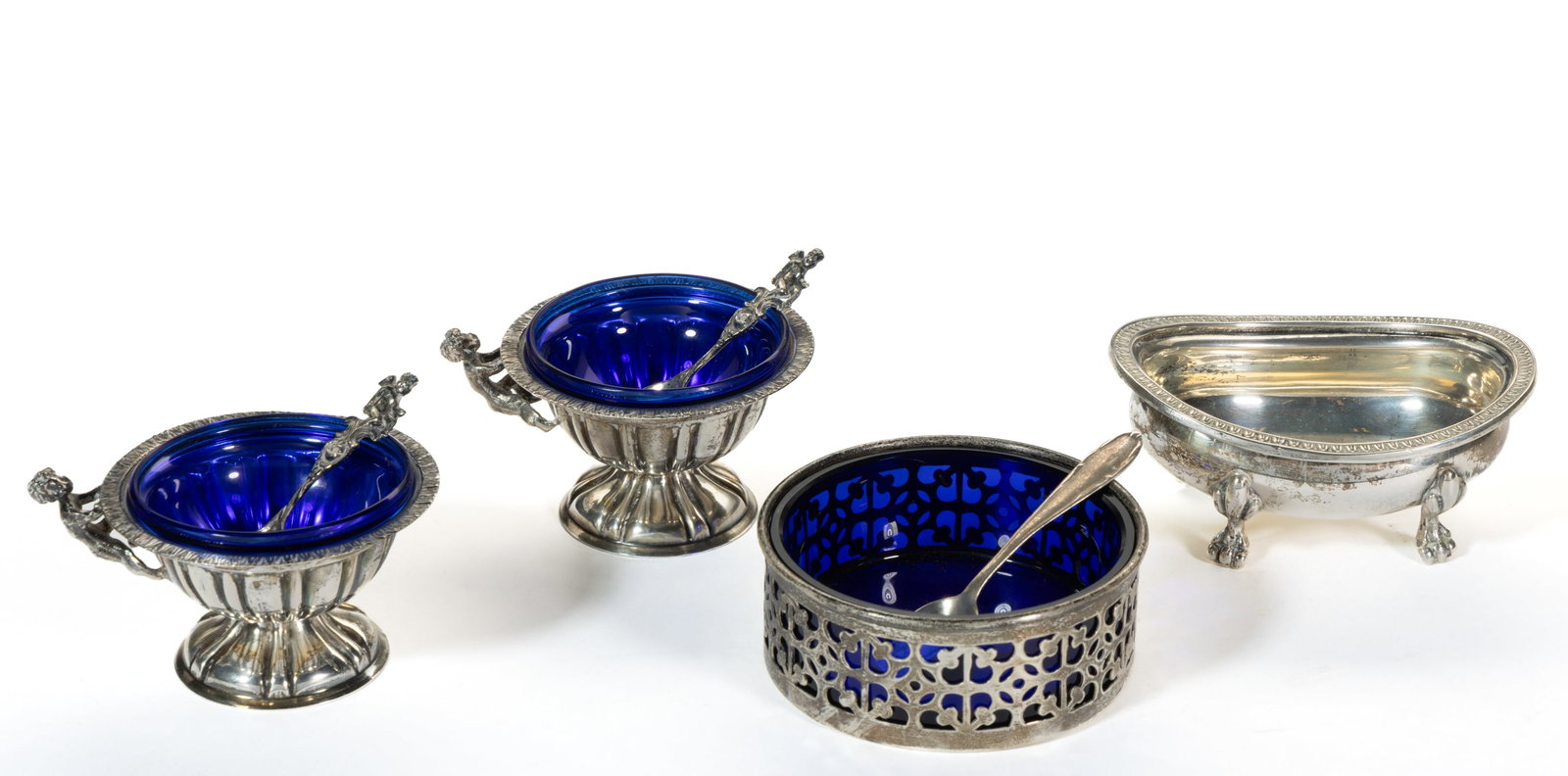 ASSORTED STERLING AND OTHER SILVER OPEN SALTS AND SALT SPOONS, LOT OF SEVEN: ASSORTED STERLING AND OTHER SILVER OPEN SALTS AND SALT SPOONS, LOT OF SEVEN, comprising an open salt by Dominick & Haff of New York City, NY (active 1872-1928) and retailed by Harris & Shafer 