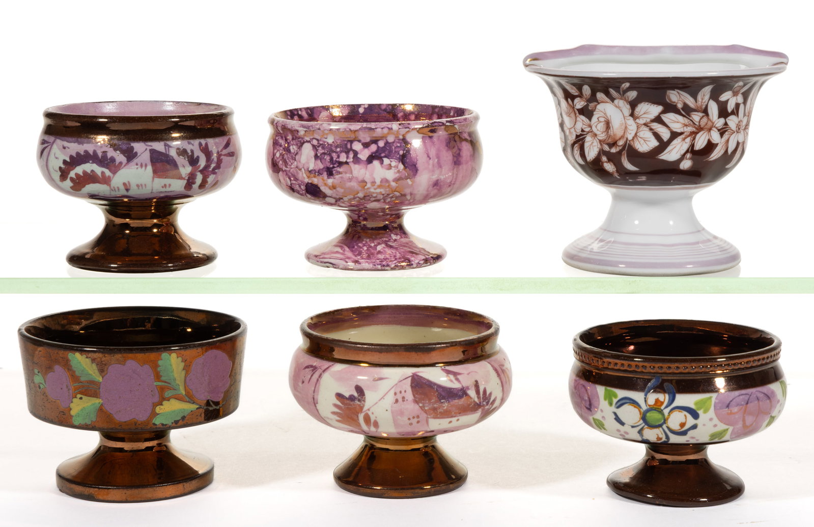 BRITISH HAND-PAINTED LUSTRE-DECORATED CERAMIC OPEN SALTS, LOT OF SIX: BRITISH HAND-PAINTED LUSTRE-DECORATED CERAMIC OPEN SALTS, LOT OF SIX, each of pedestal form, comprising one example with splashed lustre design, one example having a bar across rim and floral mot