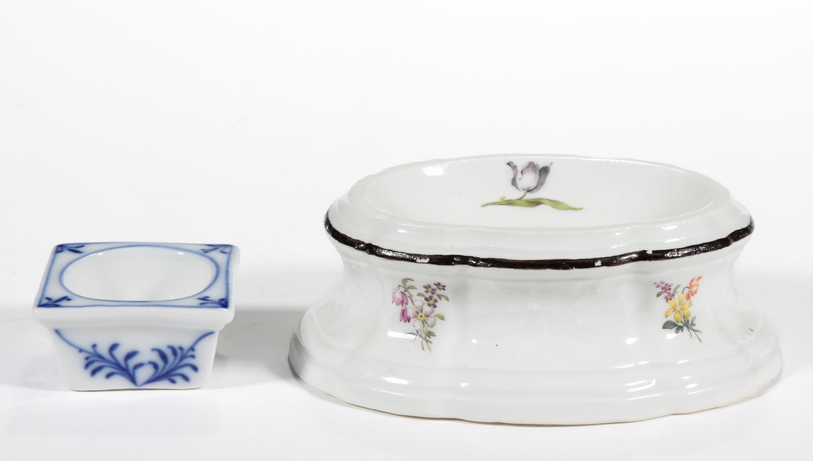 GERMAN MEISSEN PORCELAIN OPEN SALTS, LOT OF TWO: GERMAN MEISSEN PORCELAIN OPEN SALTS, LOT OF TWO, comprising one ovoid example having polychrome hand-painted floral sprig decorations and one 1 5/8" SQ example with simple blue floral design.&nbs