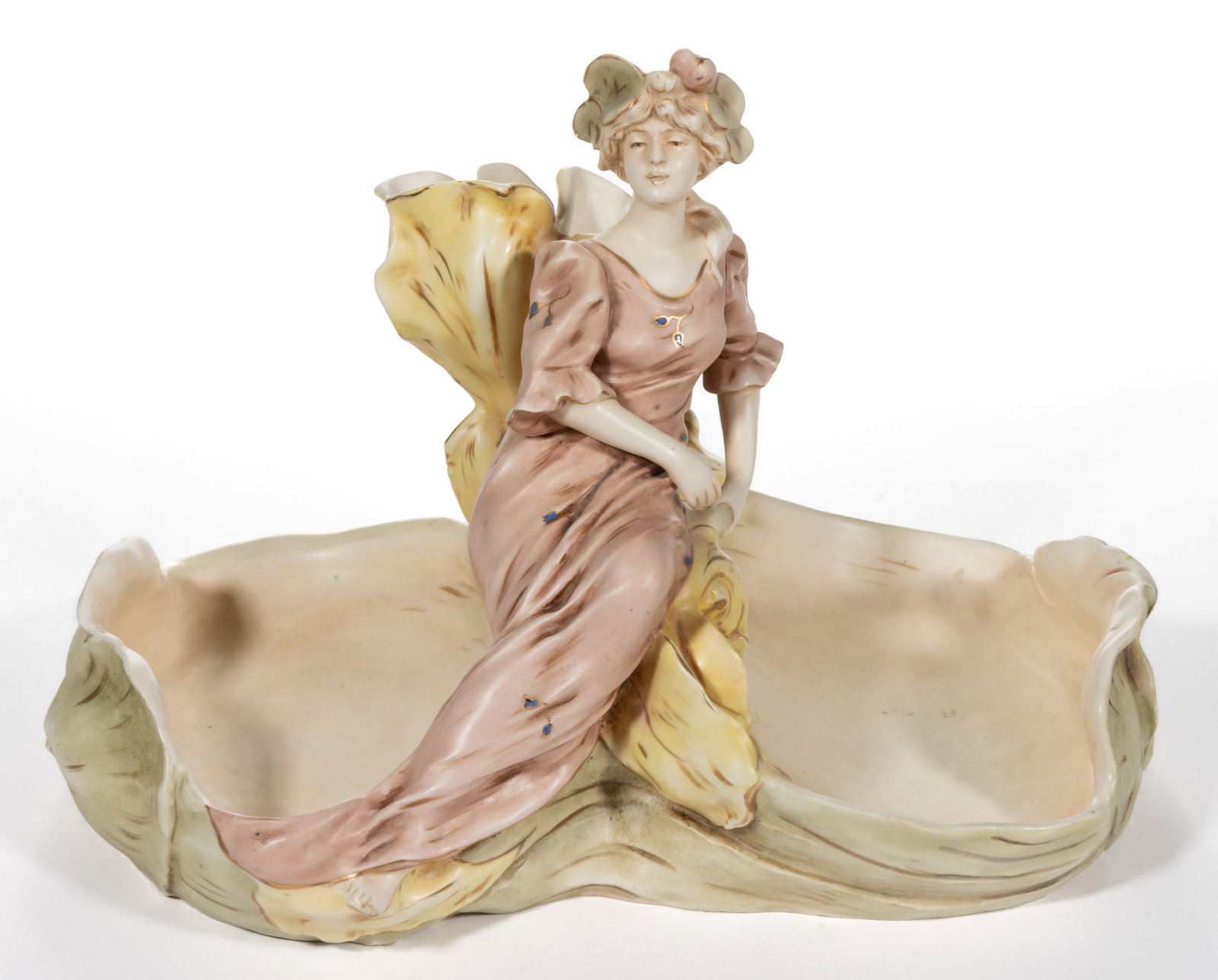 CONTINENTAL ART NOUVEAU PORCELAIN HAND-PAINTED FIGURAL CENTERPIECE: CONTINENTAL ART NOUVEAU PORCELAIN HAND-PAINTED FIGURAL CENTERPIECE, depicting a reclining woman on a large oversized yellow iris vase to center flanked by open lily pads. Marks to under