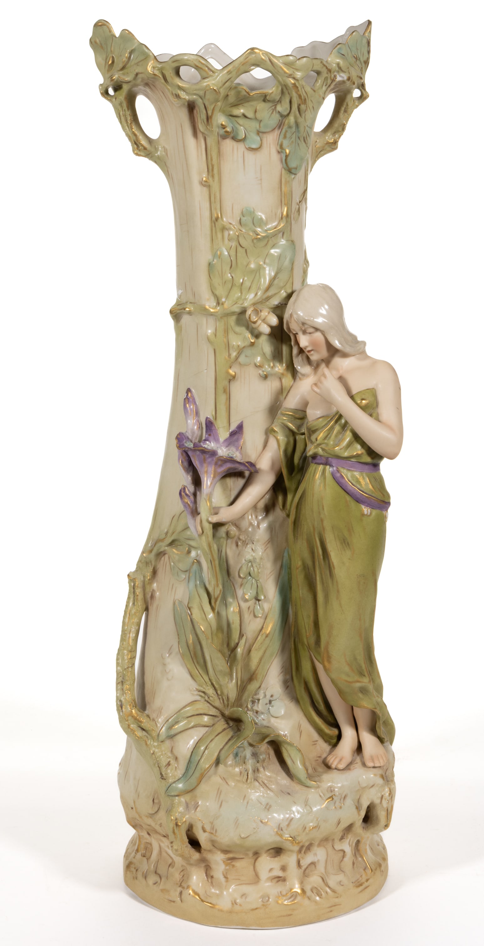 BOHEMIAN ROYAL DUX ART NOUVEAU PORCELAIN LARGE FIGURAL VASE: BOHEMIAN ROYAL DUX ART NOUVEAU PORCELAIN LARGE FIGURAL VASE, depicting a young, semi-nude standing woman with an oak tree behind and her hand grasping an oversized purple flower. Applied pin