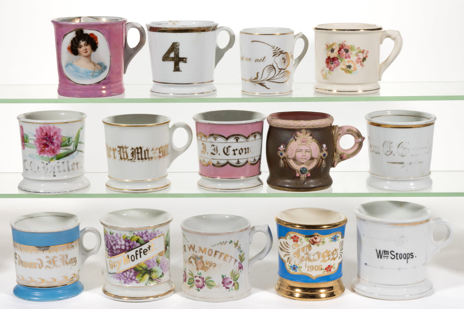 CONTINENTAL PORCELAIN SHAVING AND OTHER MUGS, LOT OF 14: CONTINENTAL PORCELAIN SHAVING AND OTHER MUGS, LOT OF 14, including one having interior well for brush and featuring a transfer of a beautiful black-haired young woman with pink lustre surround, a Scha