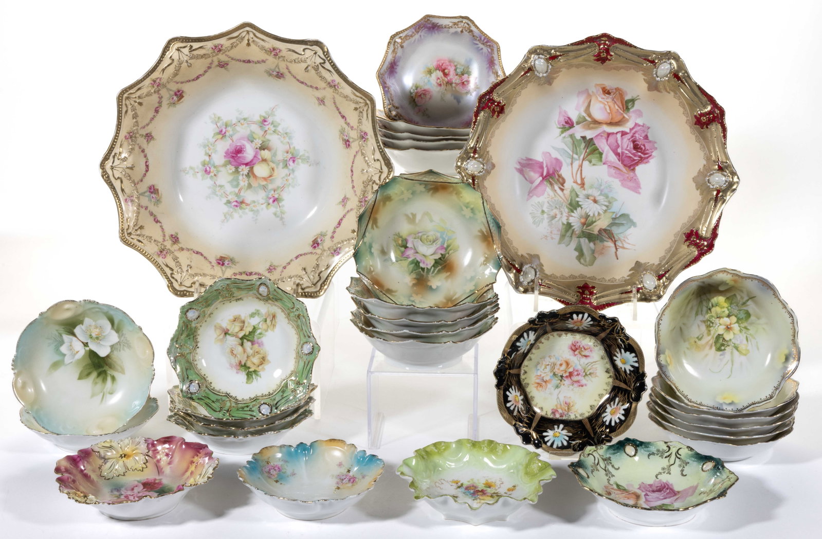 R.S. PRUSSIA PORCELAIN FLORAL MOTIF BOWLS, LOT OF 29: R.S. PRUSSIA PORCELAIN FLORAL MOTIF BOWLS, LOT OF 29, including six RSP Mold 155 examples consisting of one master bowl having rose transfer including swags with hanging baskets and five ind