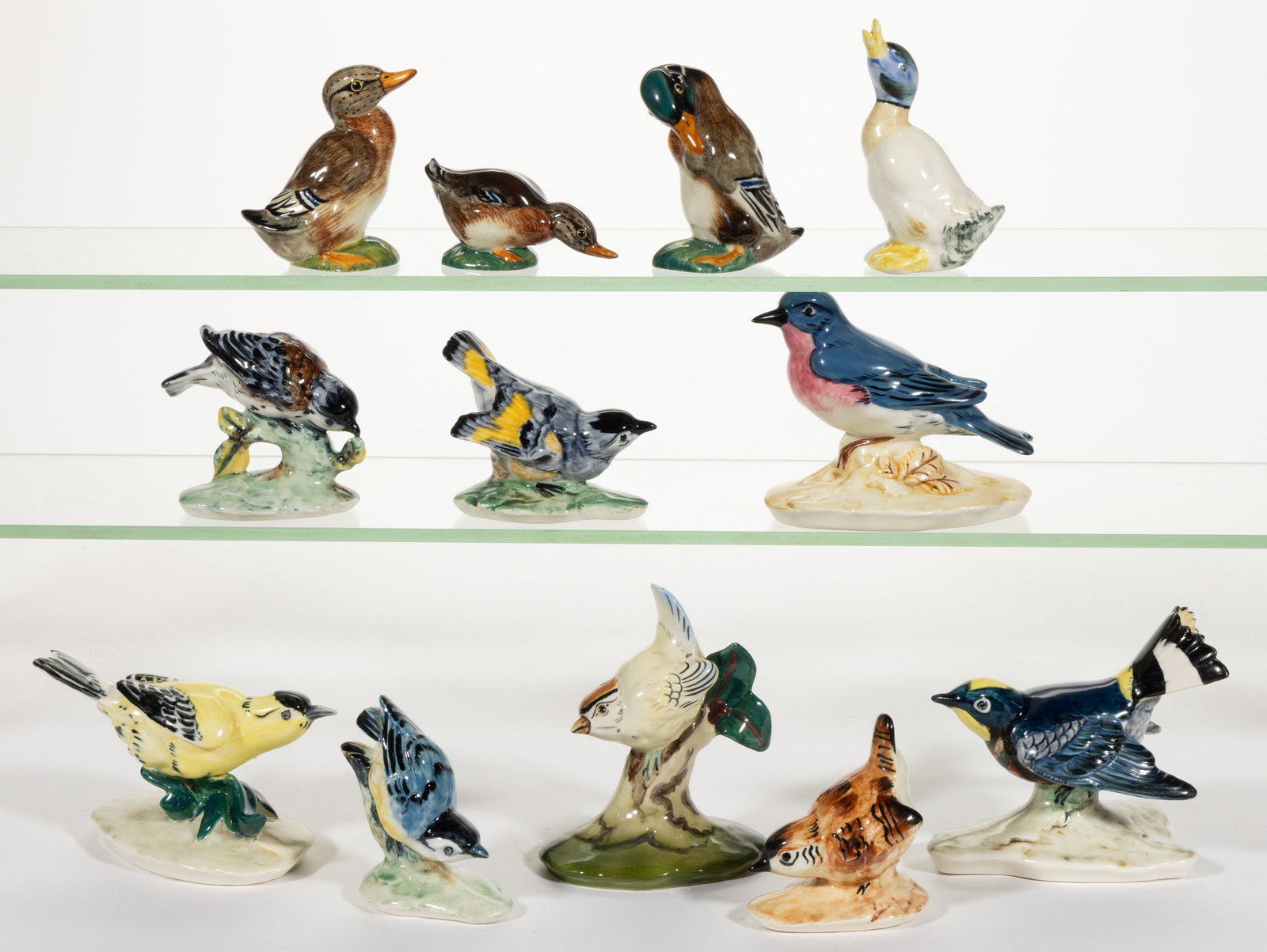 AMERICAN HAND-PAINTED CERAMIC BIRD FIGURES, LOT OF 12: AMERICAN HAND-PAINTED CERAMIC BIRD FIGURES, LOT OF 12, each having polychrome decorations, including seven Pennsbury Pottery examples consisting of a "Blue bird", "Wren", &quo