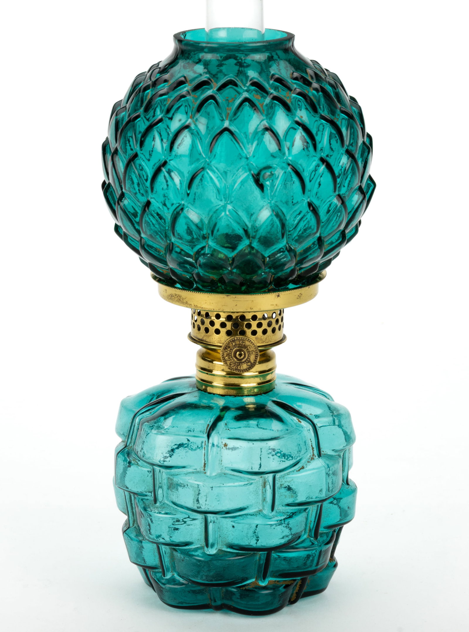 PINEAPPLE IN BASKET MINIATURE LAMP: PINEAPPLE IN BASKET MINIATURE LAMP, peacock green, basketweave patterned barrel-form font, pineapple petal patterned ball-form shade, period brass collar. Fitted with a Plume & Atwood Nutmeg 
