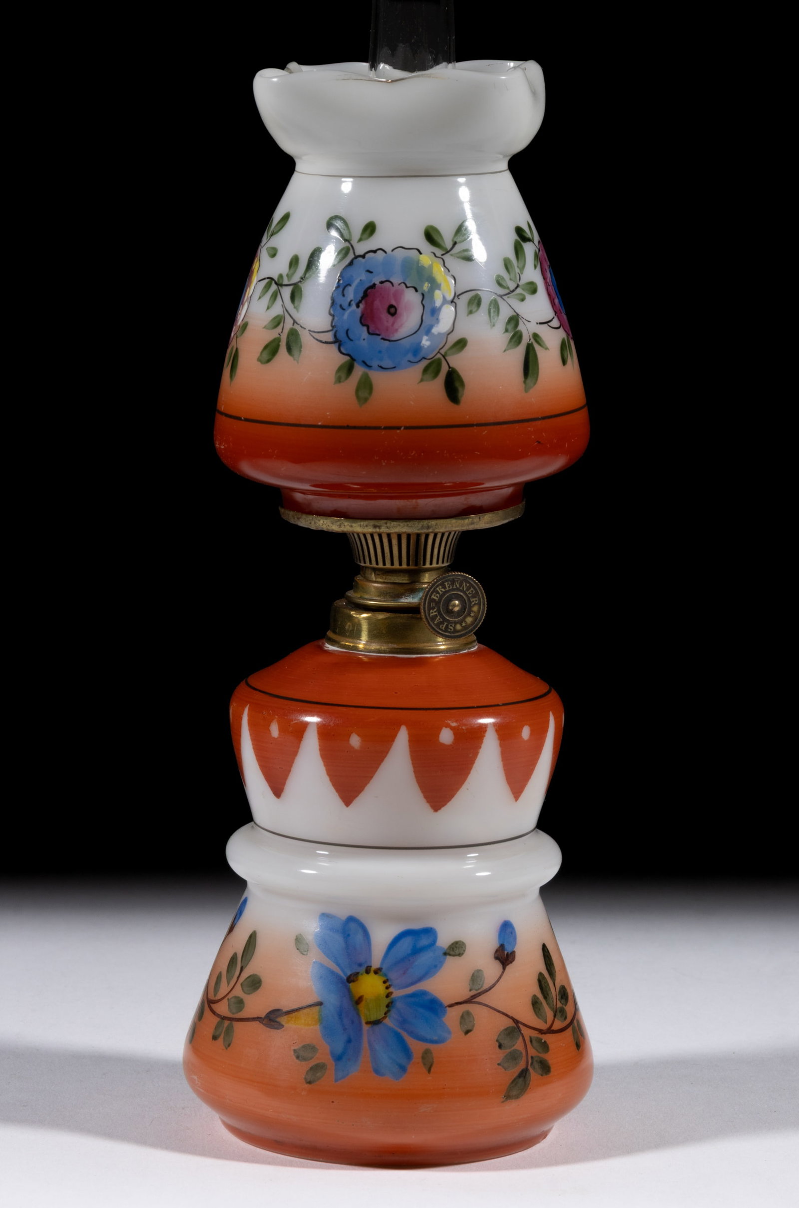 VICTORIAN DECORATED OPAQUE GLASS MINIATURE LAMP: VICTORIAN DECORATED OPAQUE GLASS MINIATURE LAMP, opaque white with orange enamel shading and polychrome floral decoration, skirted-form with pinched and ringed band waist, matching decorated tapered c