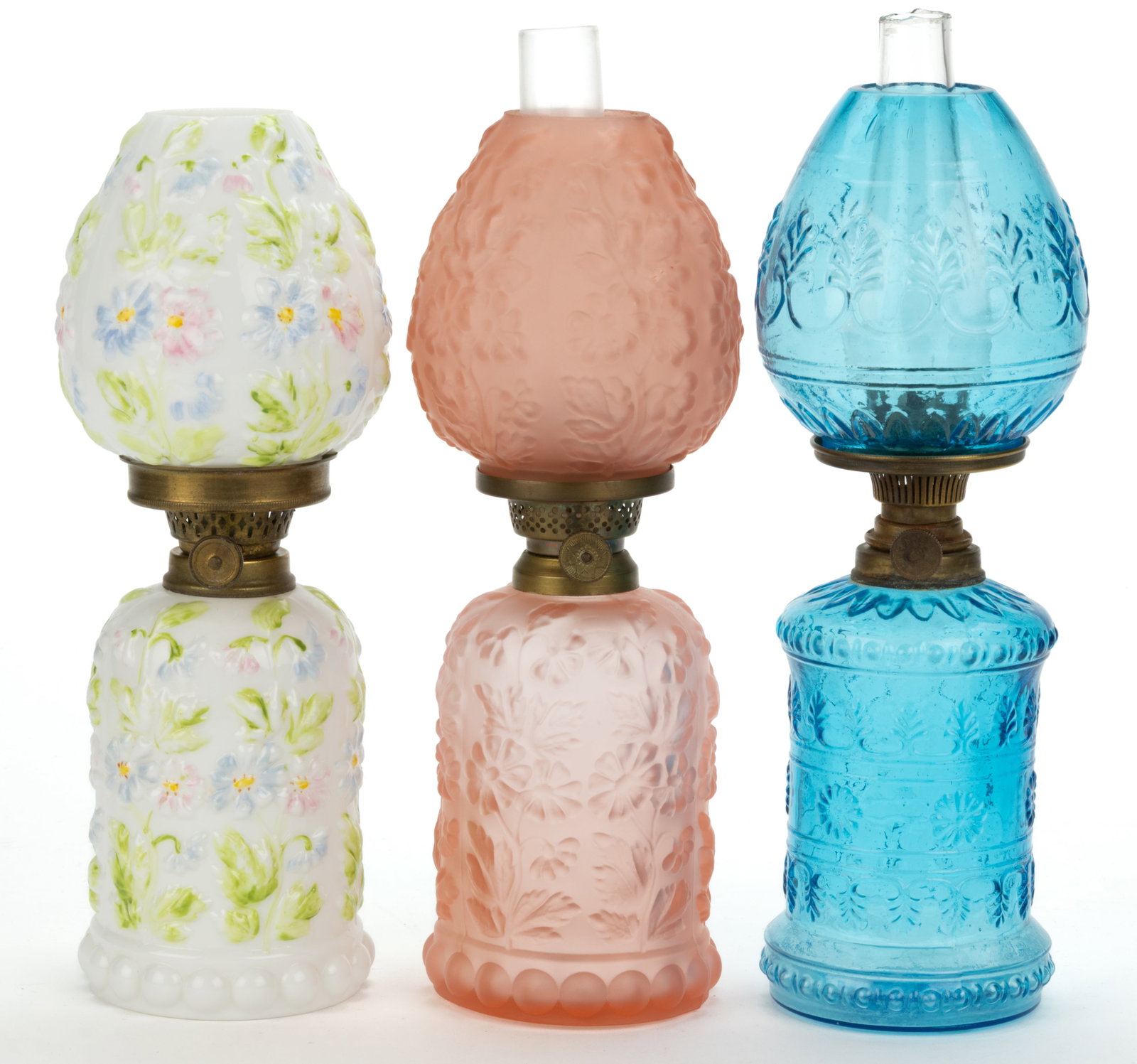 ASSORTED EMBOSSED FLORAL PATTERNED MINIATURE LAMPS, LOT OF THREE: ASSORTED EMBOSSED FLORAL PATTERNED MINIATURE LAMPS, LOT OF THREE, comprising of two Smith II, fig. 458 examples, colors of opaque white with pastel decorated flowers and a translucent rose w