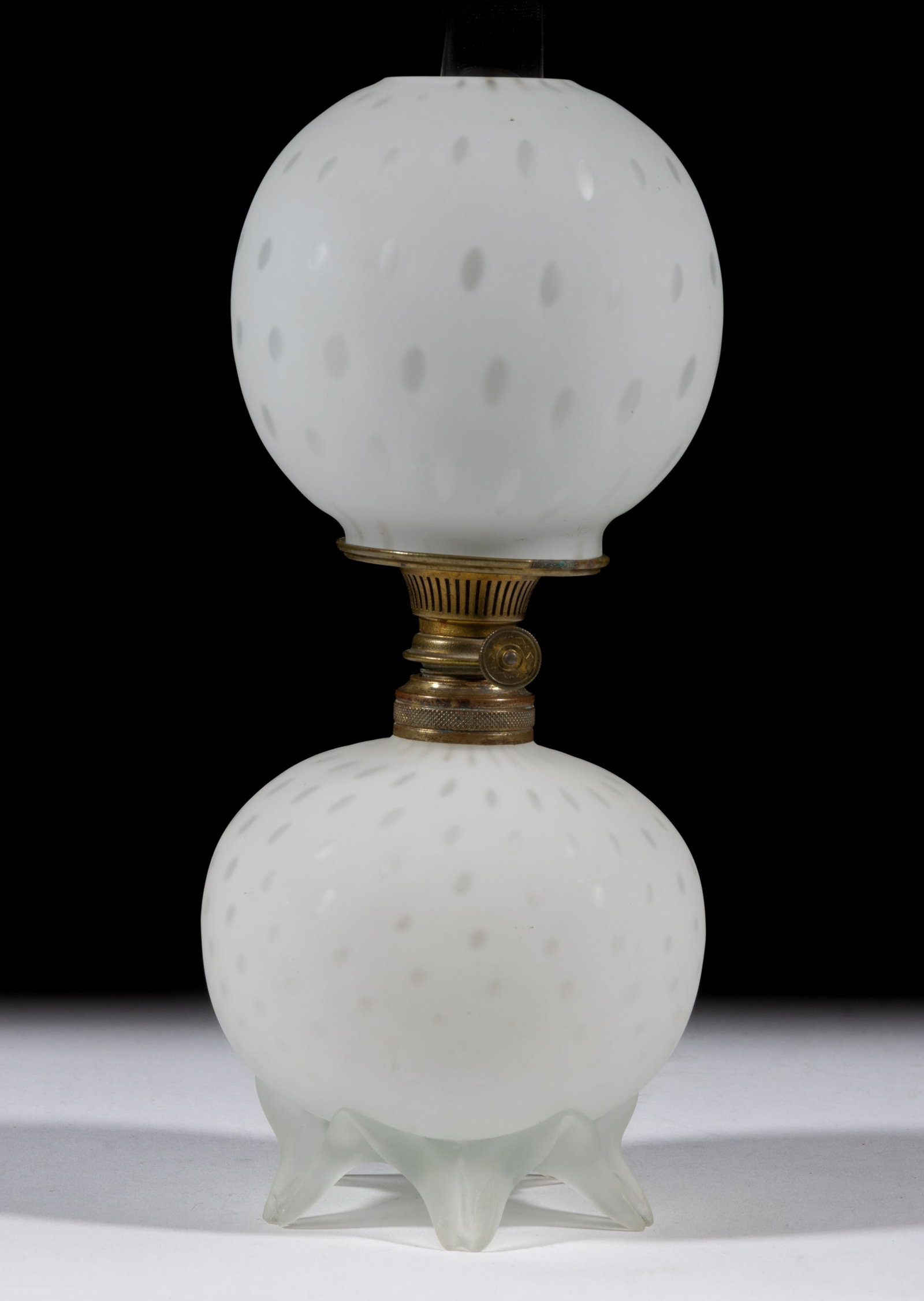 RAINDROP AIR-TRAP MOTHER-OF-PEARL SATIN MINIATURE LAMP: RAINDROP AIR-TRAP MOTHER-OF-PEARL SATIN MINIATURE LAMP, cased white, ball-form font, colorless and frosted applied base with five raised toes, each with pressed rib pattern, matching patterned elongat