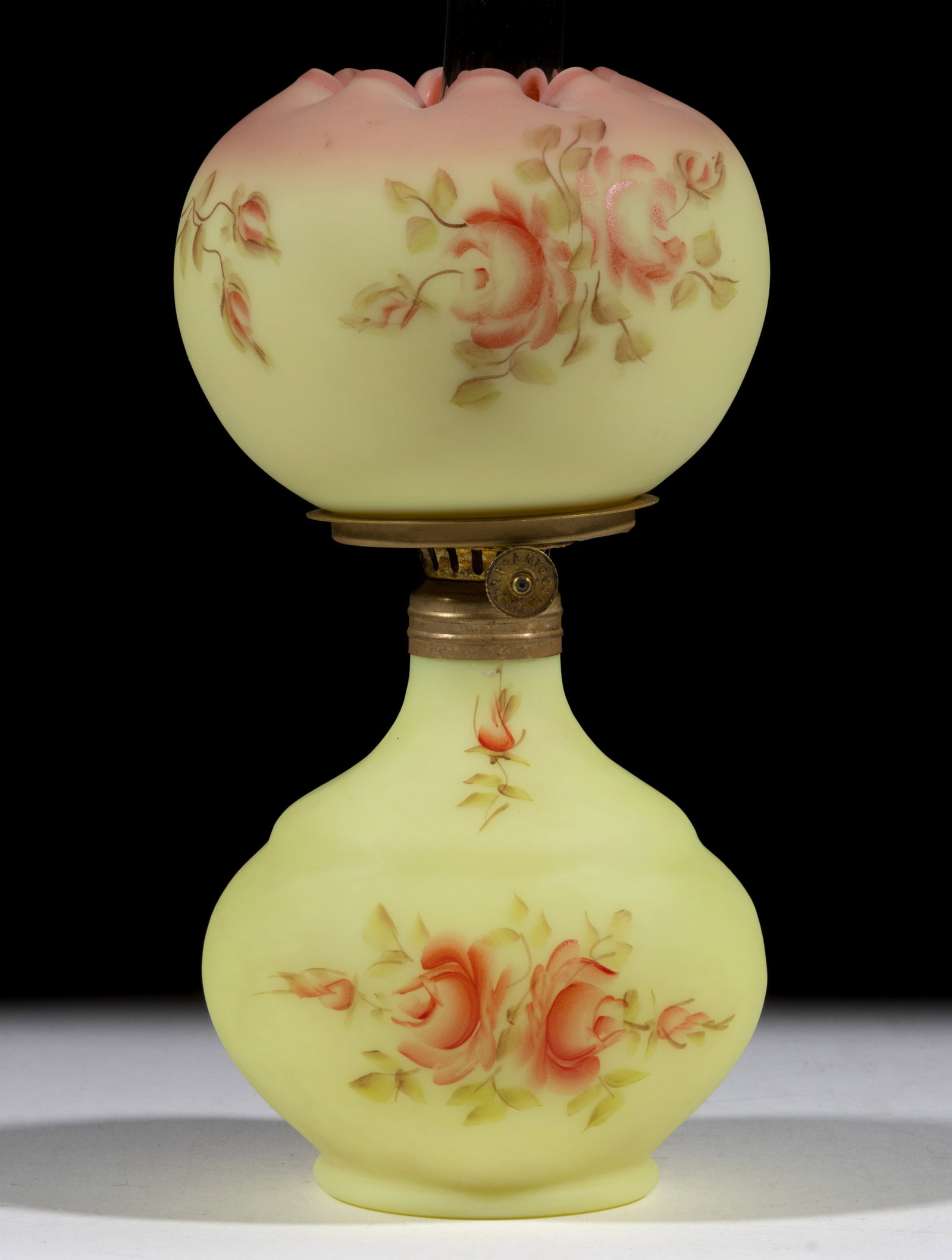 FENTON / L. G. WRIGHT DECORATED SATIN BURMESE GLASS MINIATURE LAMP: FENTON / L. G. WRIGHT DECORATED SATIN BURMESE GLASS MINIATURE LAMP, Burmese with polychrome rose decoration, globular-form font with stepped shoulder, matching decorated ball-form shade with folded-in