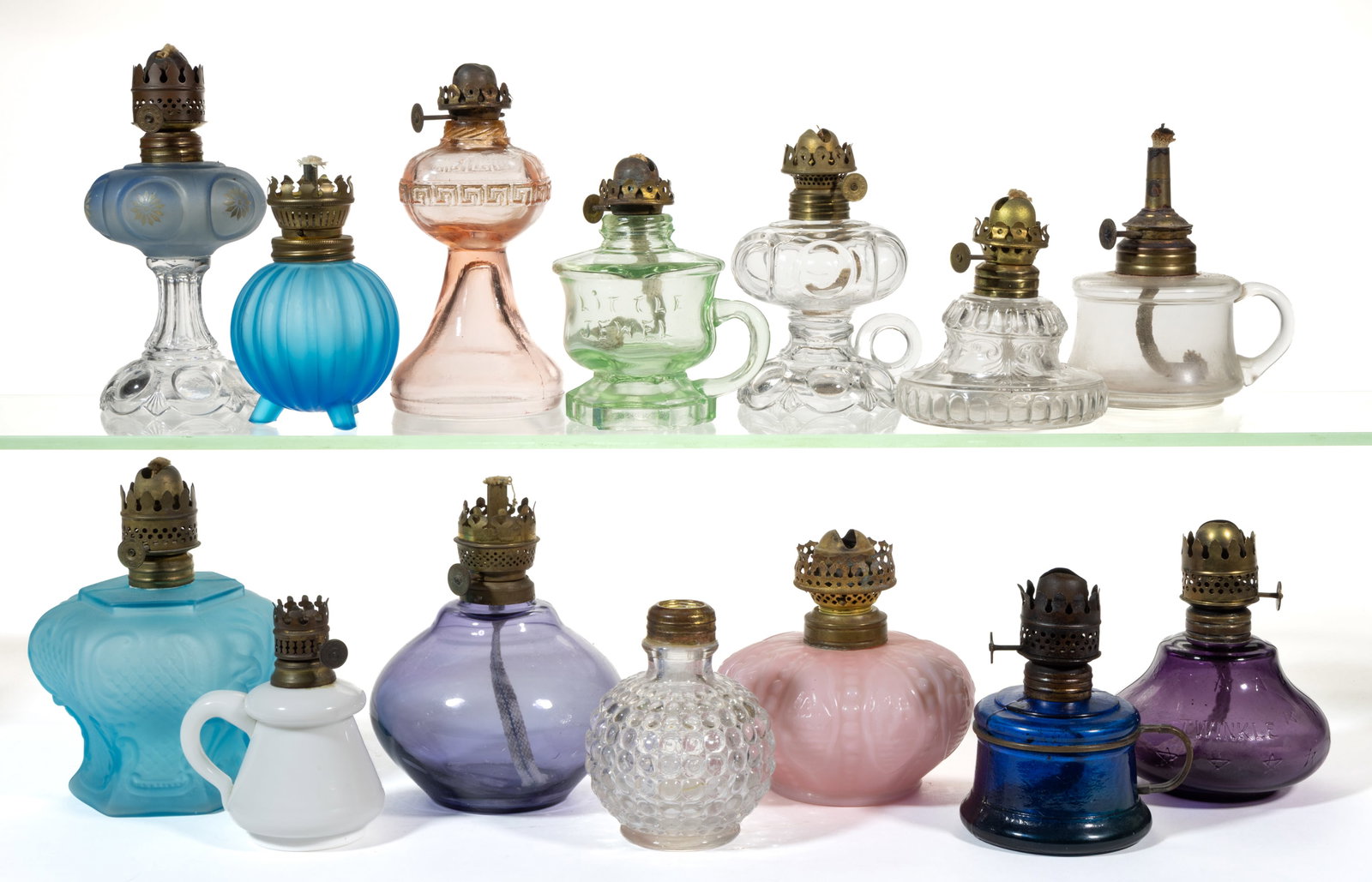 ASSORTED PATTERNED MINIATURE LAMP FONTS, LOT OF 14: ASSORTED PATTERNED MINIATURE LAMP FONTS, LOT OF 14, various colors, patterns include a cobalt blue Nutmeg/Smith I, fig. 29 with brass ring handle; a purple Twinkle/Smith I, fig. 432; a footed finger a