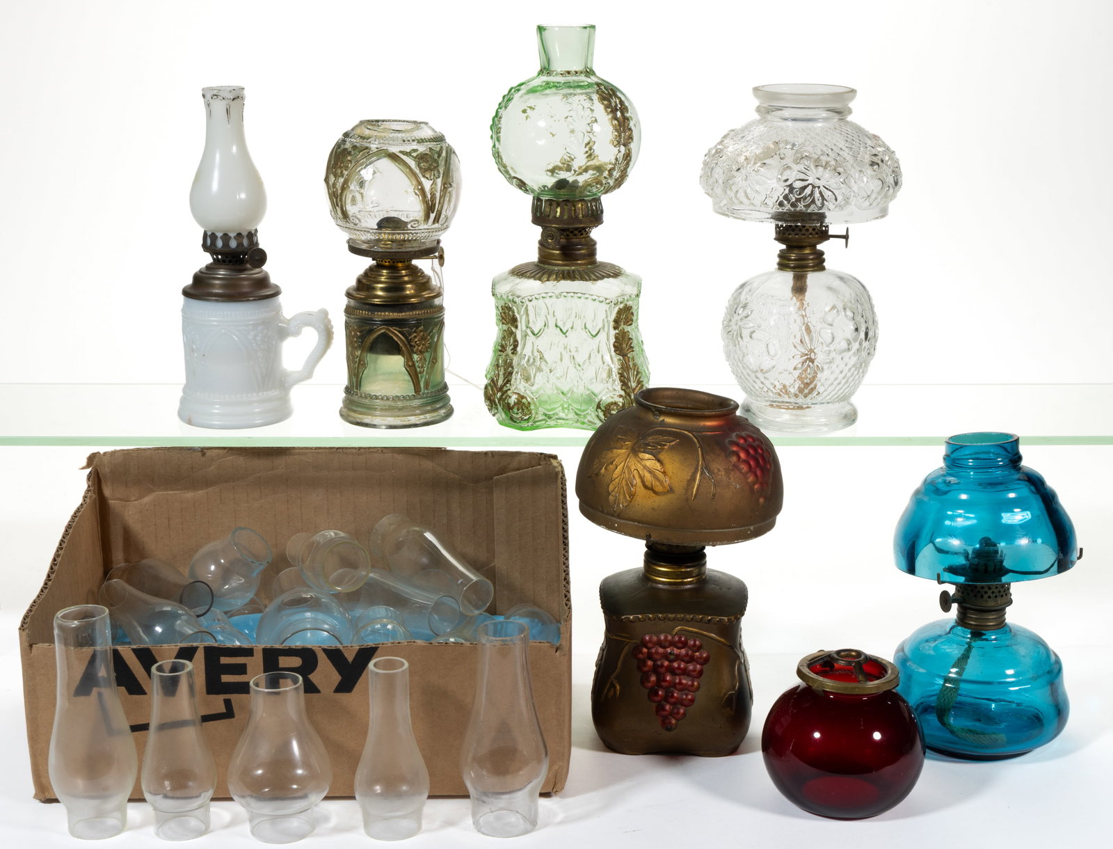 ASSORTED PATTERNED MINIATURE LAMPS, SHADES AND CHIMNEYS, UNCOUNTED LOT: ASSORTED PATTERNED MINIATURE LAMPS, SHADES AND CHIMNEYS, UNCOUNTED LOT, including seven lamps, patterns include two Gothic Arch/Smith I, fig. 163 examples; a colorless Cosmos/Smith I, fig. 2