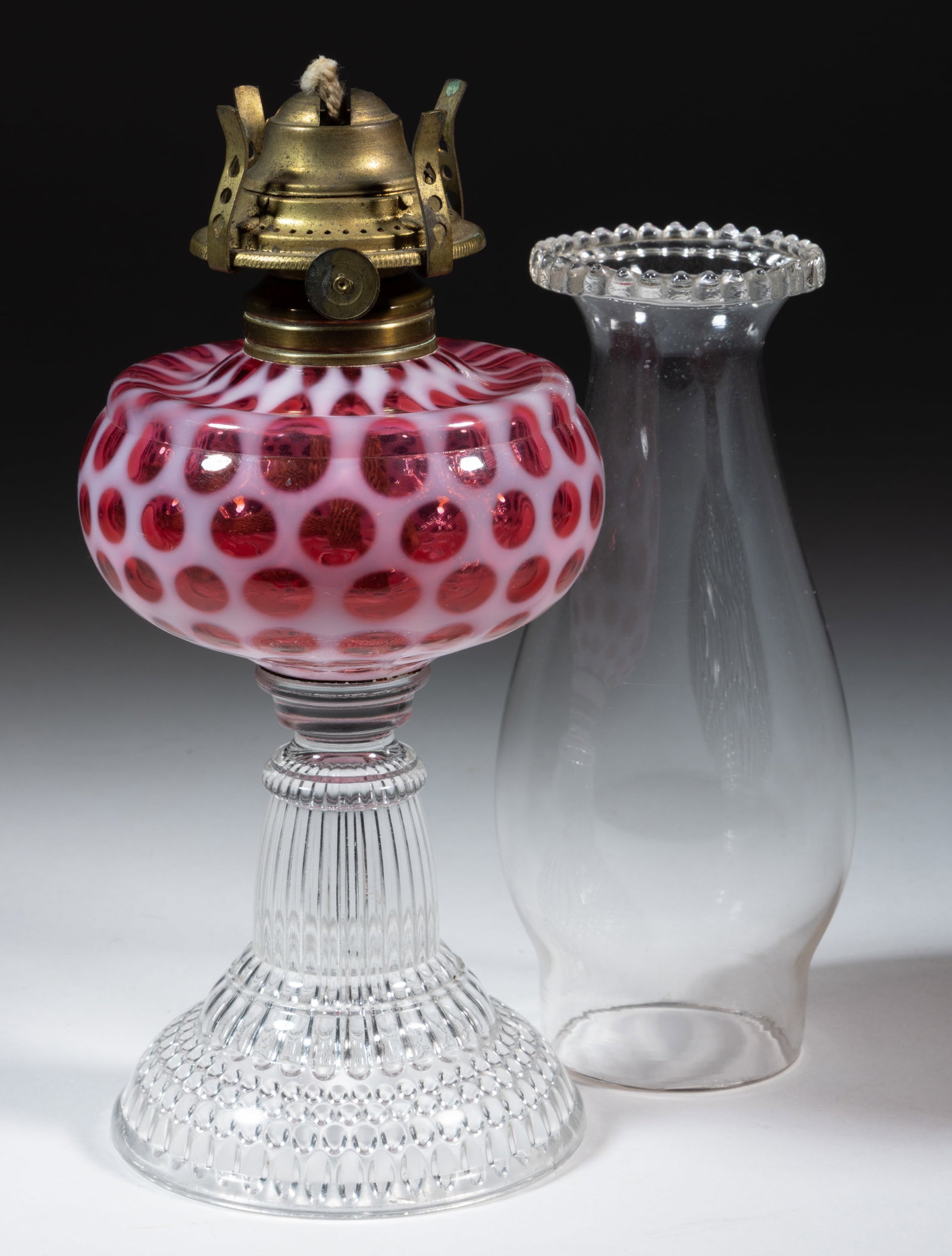 HOBBS NO. 326 WINDOWS / COIN DOT - PETITE SIZE KEROSENE STAND LAMP: HOBBS NO. 326 WINDOWS / COIN DOT - PETITE SIZE KEROSENE STAND LAMP, Ruby/cranberry opalescent font, colorless Dew Drop base, No. 1 Taplin-Brown collar. Fitted with a period setup comprising a No.