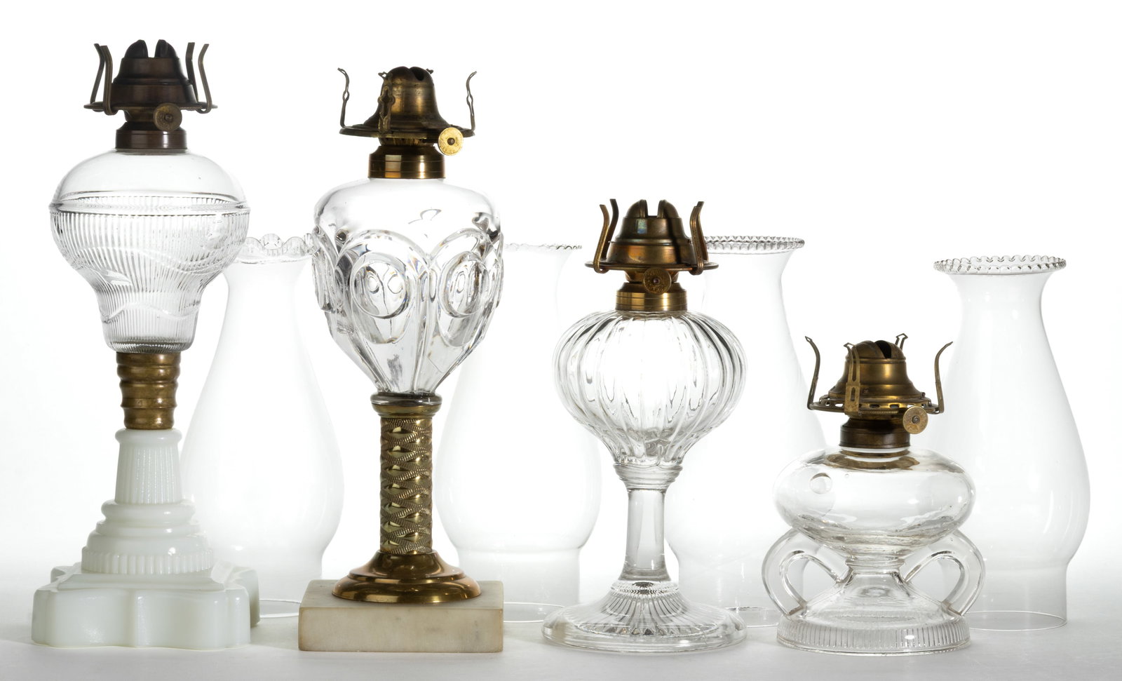 ASSORTED PATTERNED KEROSENE FINGER AND STAND LAMPS, LOT OF FOUR (1 of 1)