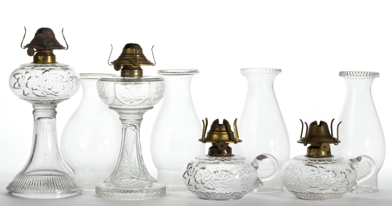 ASSORTED FLORAL PATTERNED KEROSENE FINGER AND STAND LAMPS, LOT OF FOUR (1 of 1)