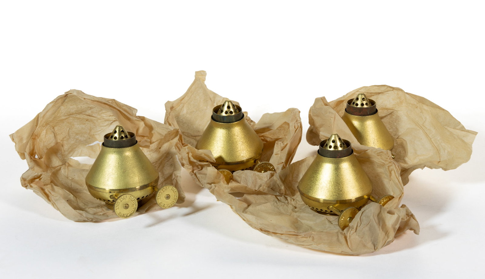 HUTCHINSON'S UNUSED NO. 1 CHIMNEYLESS KEROSENE LAMP BURNERS, LOT OF FOUR: HUTCHINSON'S UNUSED NO. 1 CHIMNEYLESS KEROSENE LAMP BURNERS, LOT OF FOUR, brass, each central draft with dual thumbwheels which raise two independent wicks, each thumbwheel marked "HUTCHINSON