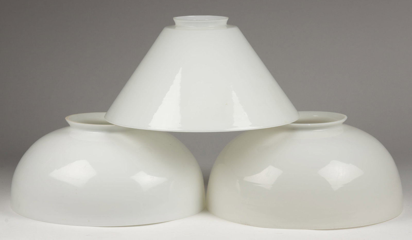 ASSORTED OPAQUE GLASS KEROSENE HANGING LAMP SHADES, LOT OF THREE: ASSORTED OPAQUE GLASS KEROSENE HANGING LAMP SHADES, LOT OF THREE, opaque white, comprising of two near pair umbrella form examples 6 1/4" H, 6" D top rim, 13 7/8" D fitter and 6 3/8&quo