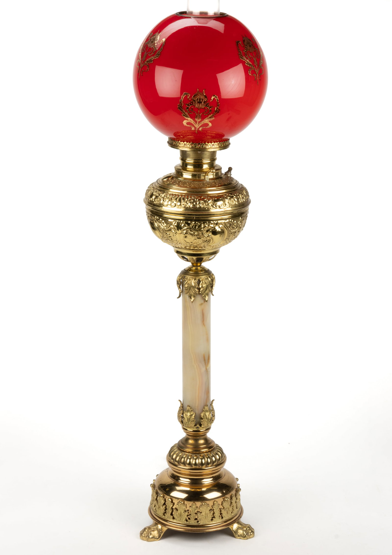 BRASS AND ONYX KEROSENE BANQUET TABLE LAMP: BRASS AND ONYX KEROSENE BANQUET TABLE LAMP, cast metal standard with gilded and brass finish, globular-form vase with heavily detailed medallions, scrolls, and beading; stem with bands of ac