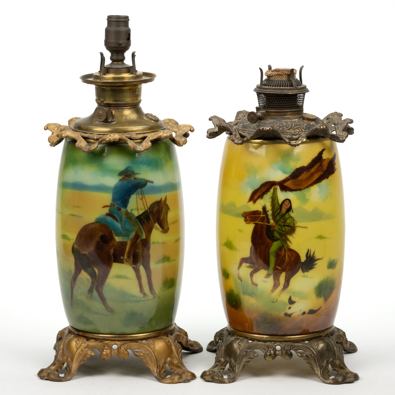 ASSORTED FOSTORIA DECORATED KEROSENE GONE WITH THE WIND / PARLOR / TABLE LAMP BASES, LOT OF TWO: ASSORTED FOSTORIA DECORATED KEROSENE GONE WITH THE WIND / PARLOR / TABLE LAMP BASES, LOT OF TWO, each having an opaque white slightly bulging cylinder-form vase holder, yellow-green shading, comprisin
