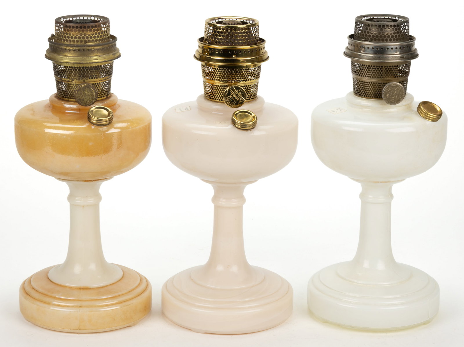 ALADDIN MODEL B-27, B-76A, AND B-30 / SIMPLICITY KEROSENE STAND LAMPS, LOT OF THREE: ALADDIN MODEL B-27, B-76A, AND B-30 / SIMPLICITY KEROSENE STAND LAMPS, LOT OF THREE, comprising an Ivory Alacite with Gold Lustre example; a Plain Ivory Alacite example with the base having some light